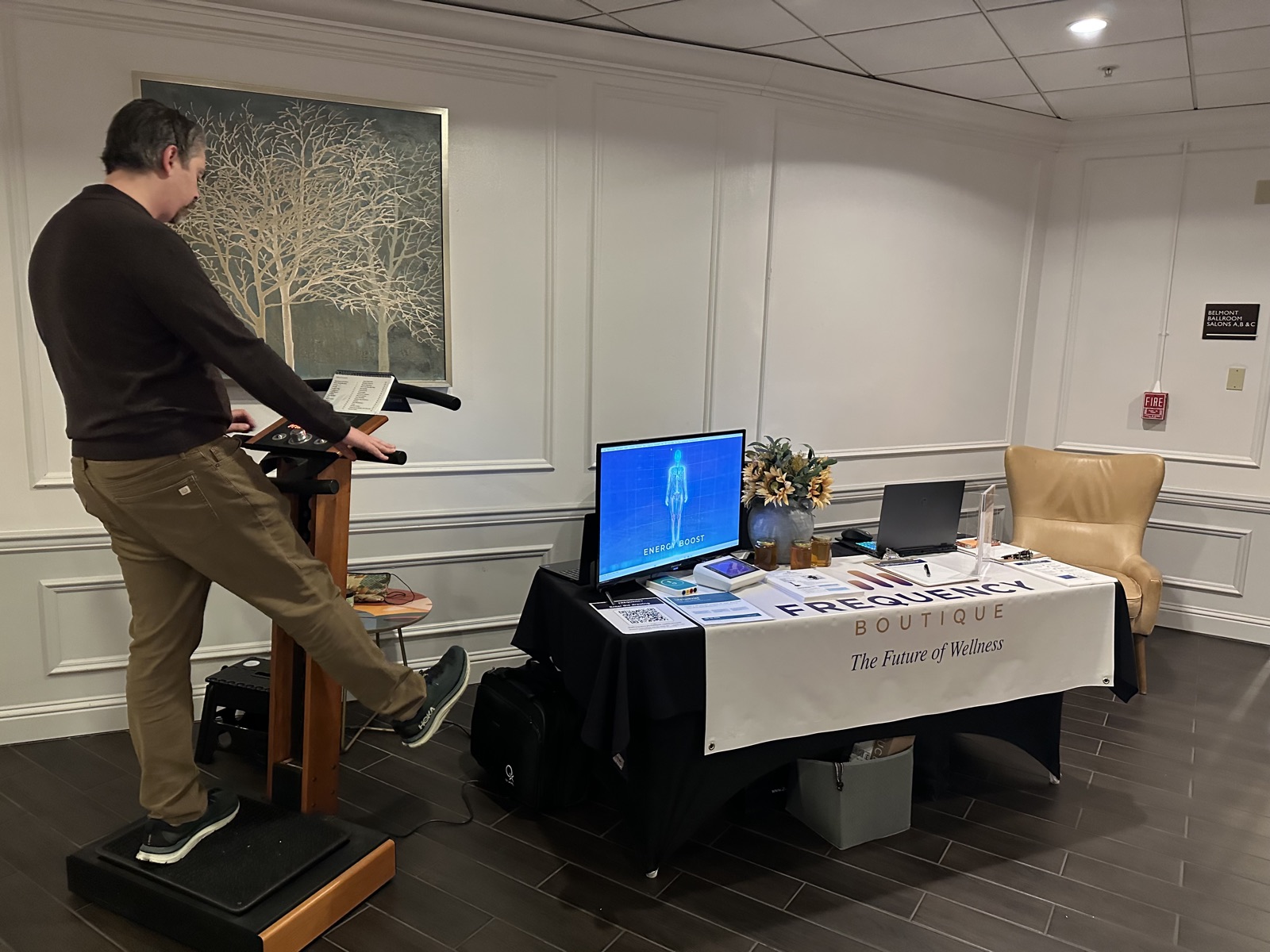 Geoff Belleville demonstrating the LifetimeVibe platform at a wellness event booth