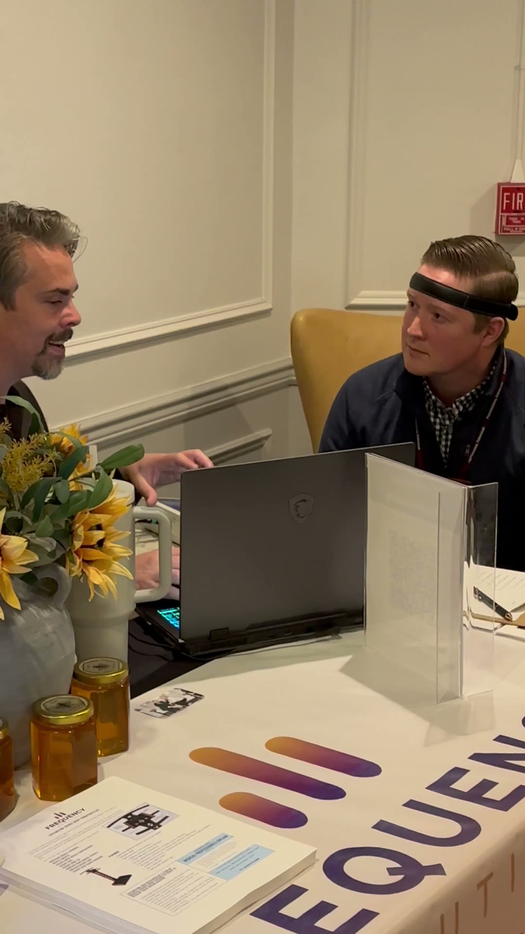 A guest wearing the session headband at the booth