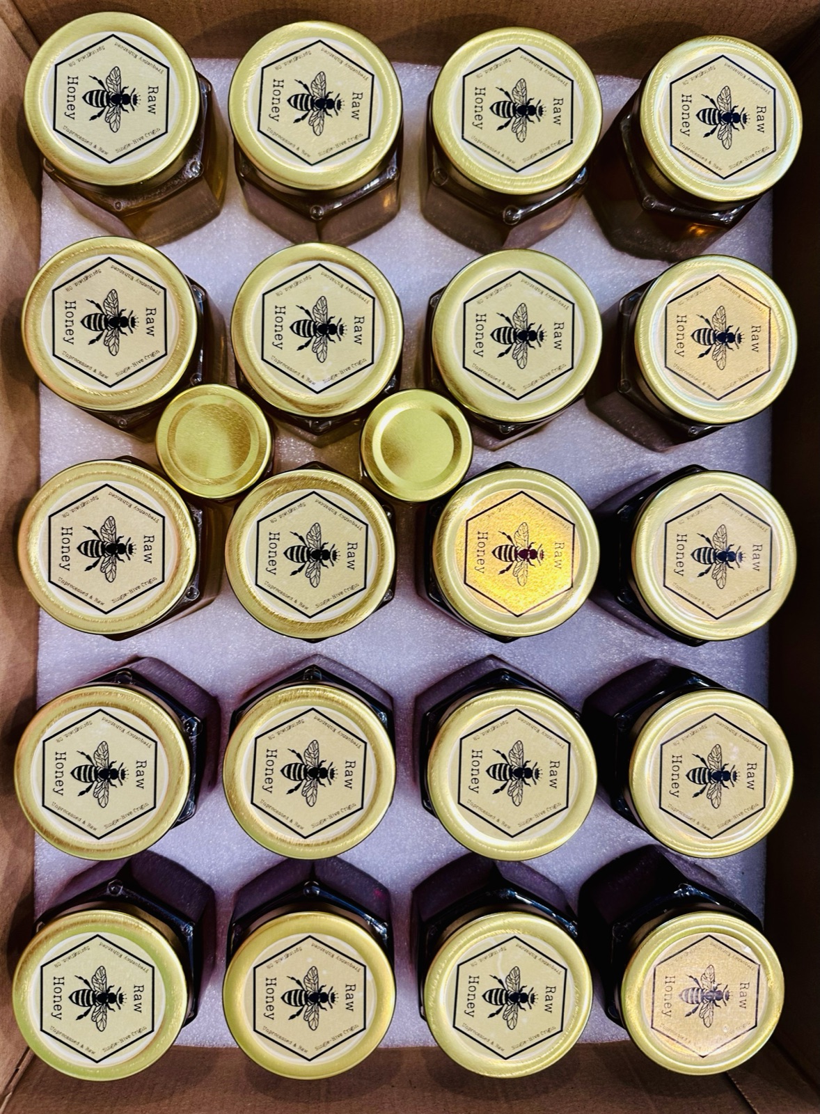 Jars of Villa Bee honey from above