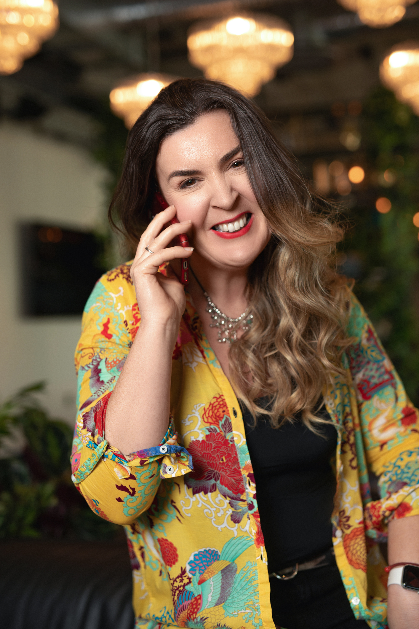 Professional high-fashion portrait of executive mentor Alana O'Regan against warm editorial background