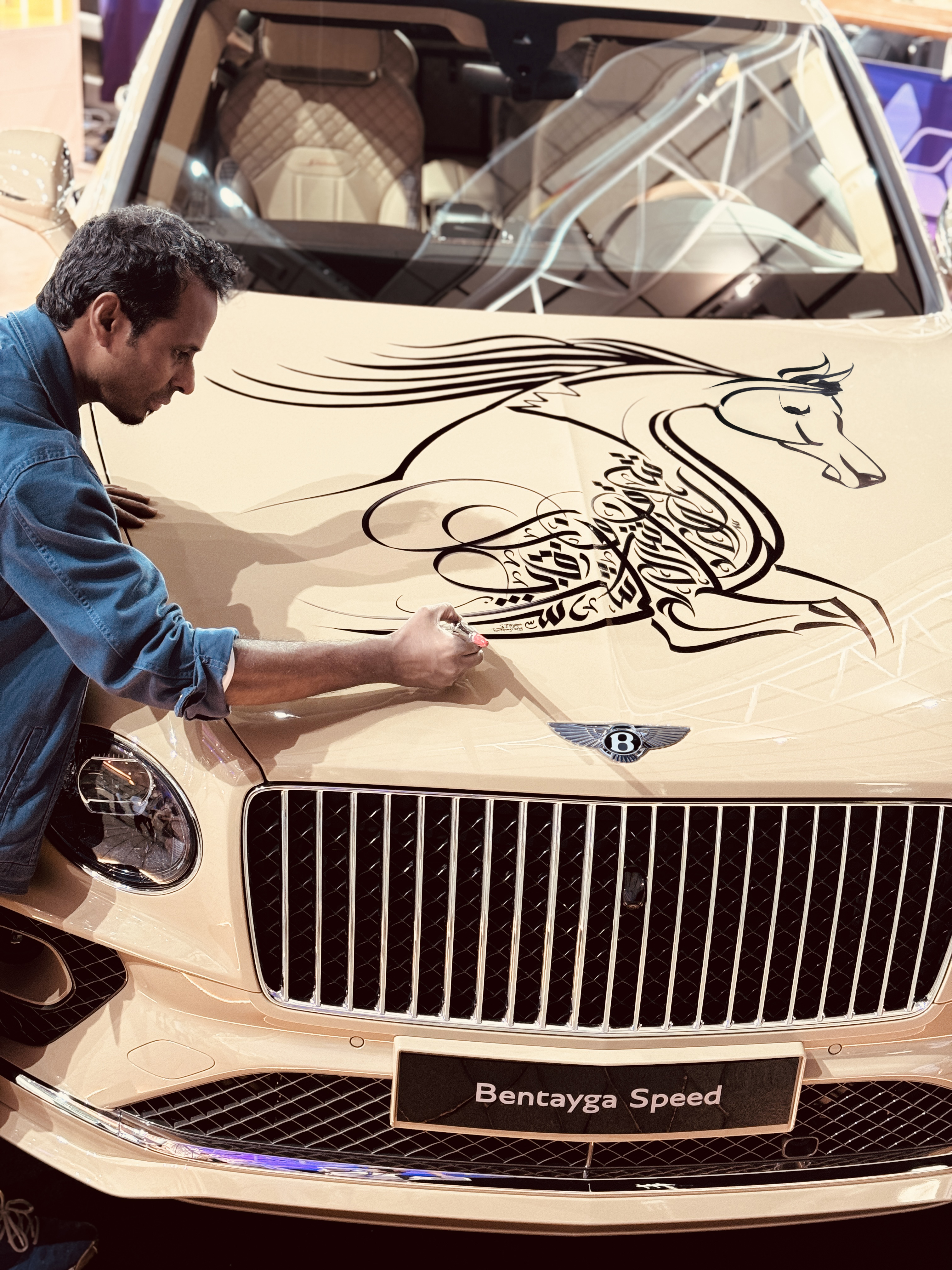 Kareem’s live calligraphy on a Bentley, Doha 2024