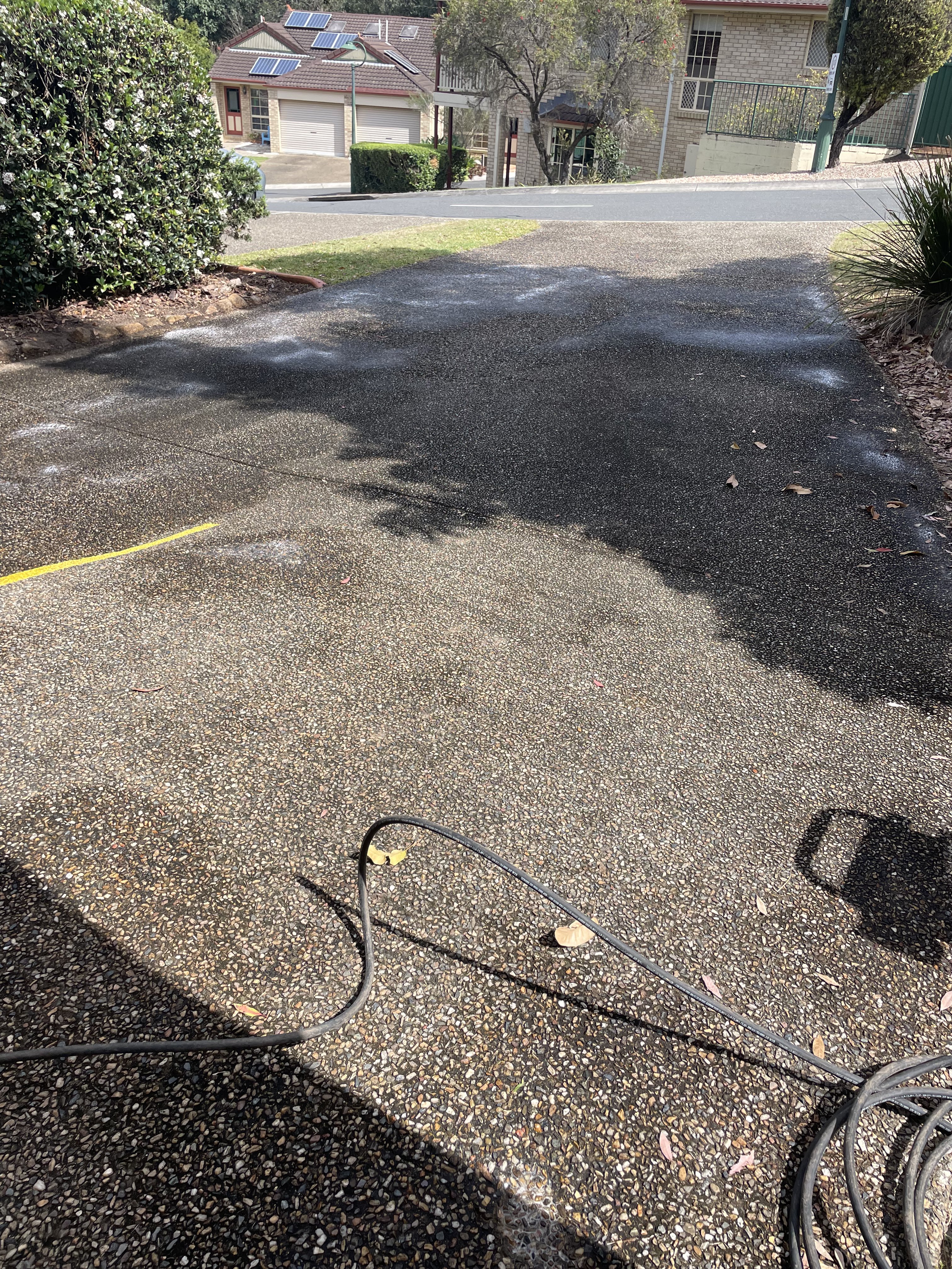 Driveway before pressure washing