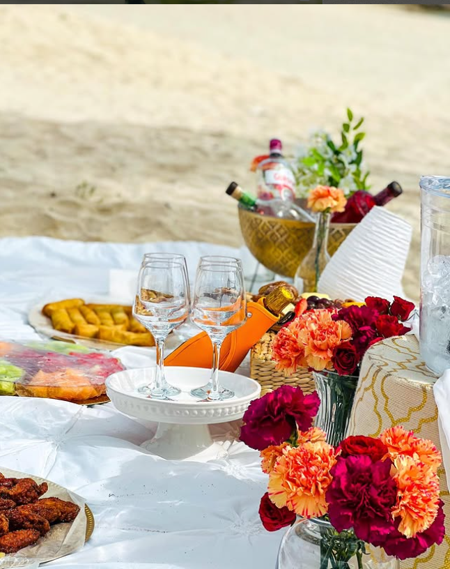 Styled luxury picnic with layered textiles and tableware
