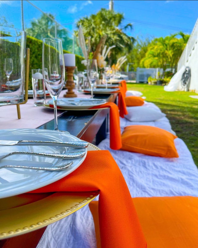 Beachfront luxury picnic with styled place settings
