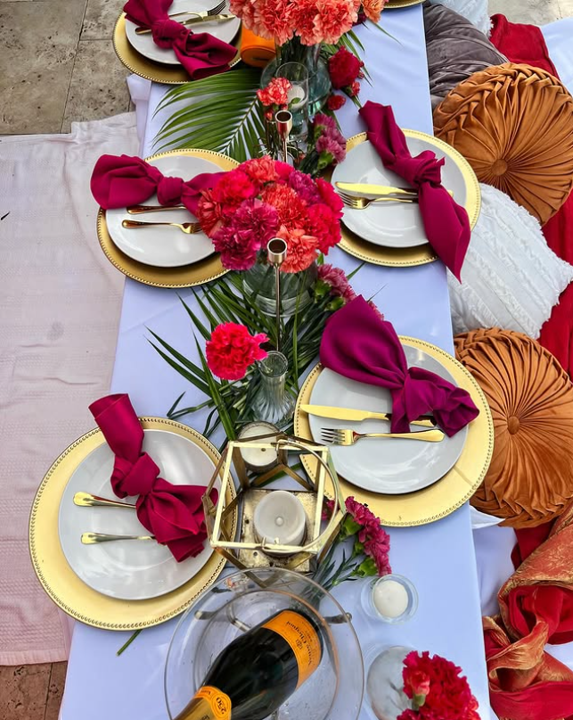 Luxury picnic table styled with florals and elegant tableware