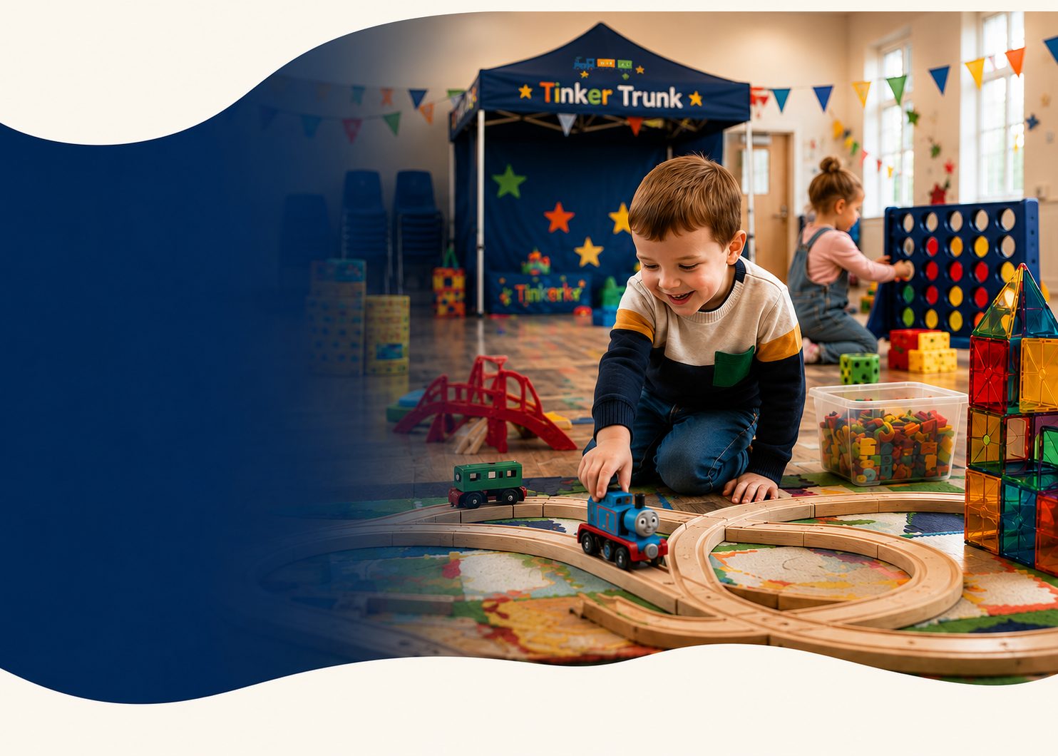 Toddler and parent connecting wooden Thomas train tracks together Toddler and parent connecting wooden Thomas train tracks together