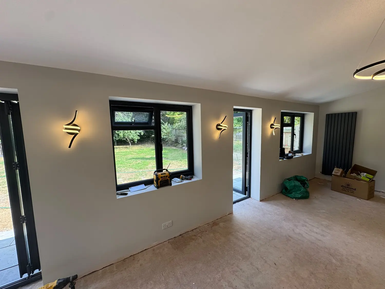 Feature wall lights chased into the wall and flush-plastered