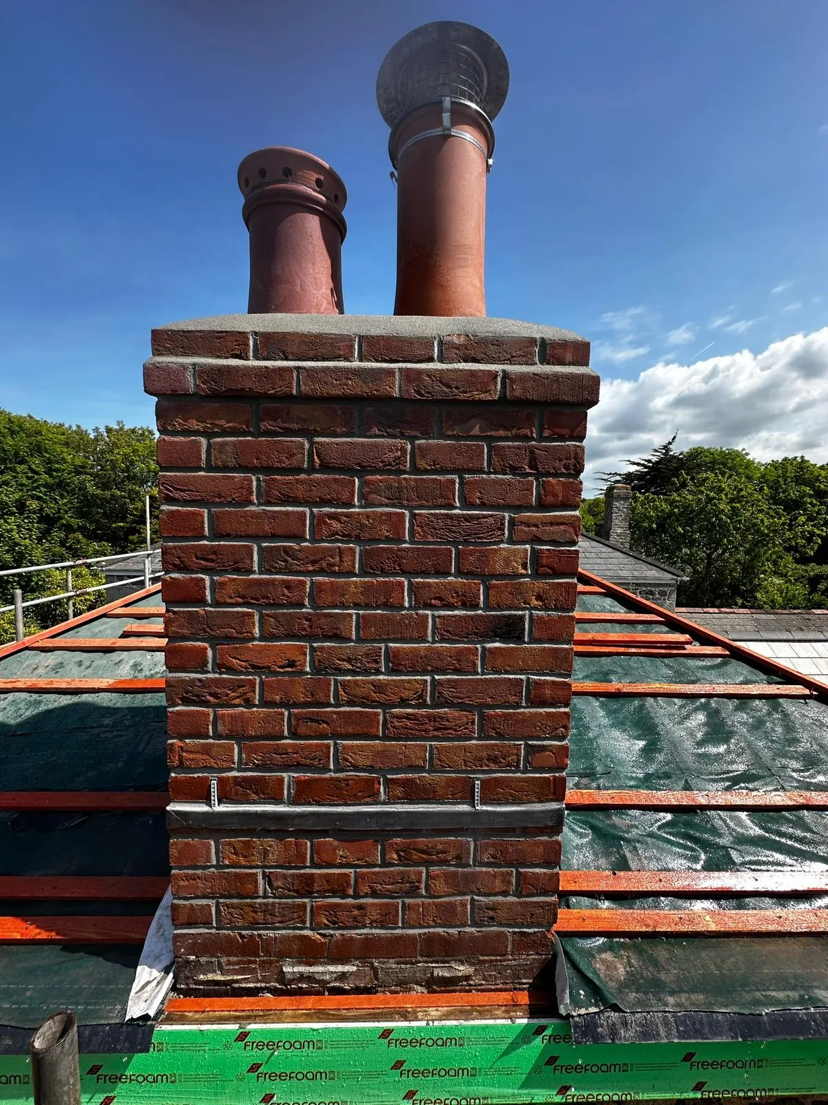 Roofline chimney rebuild by L W Construction — rural twin-pot, Cornwall