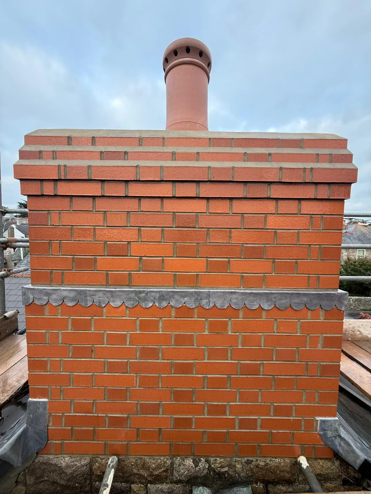 Roofline chimney rebuild by L W Construction — town single-pot, Cornwall — after
