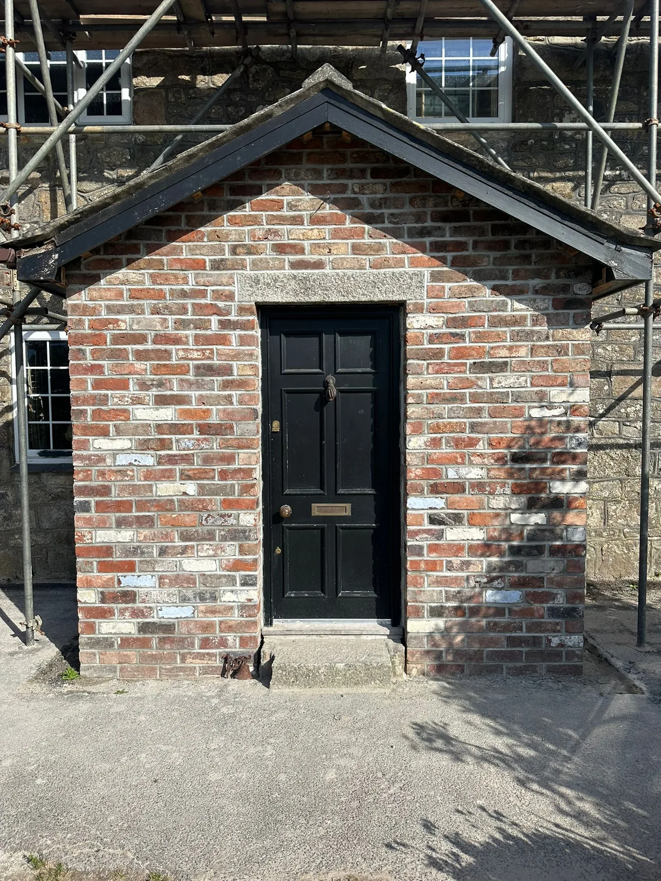 Decorative brickwork in progress by L W Construction — Nancledra, Cornwall — scaffold and front-side detail