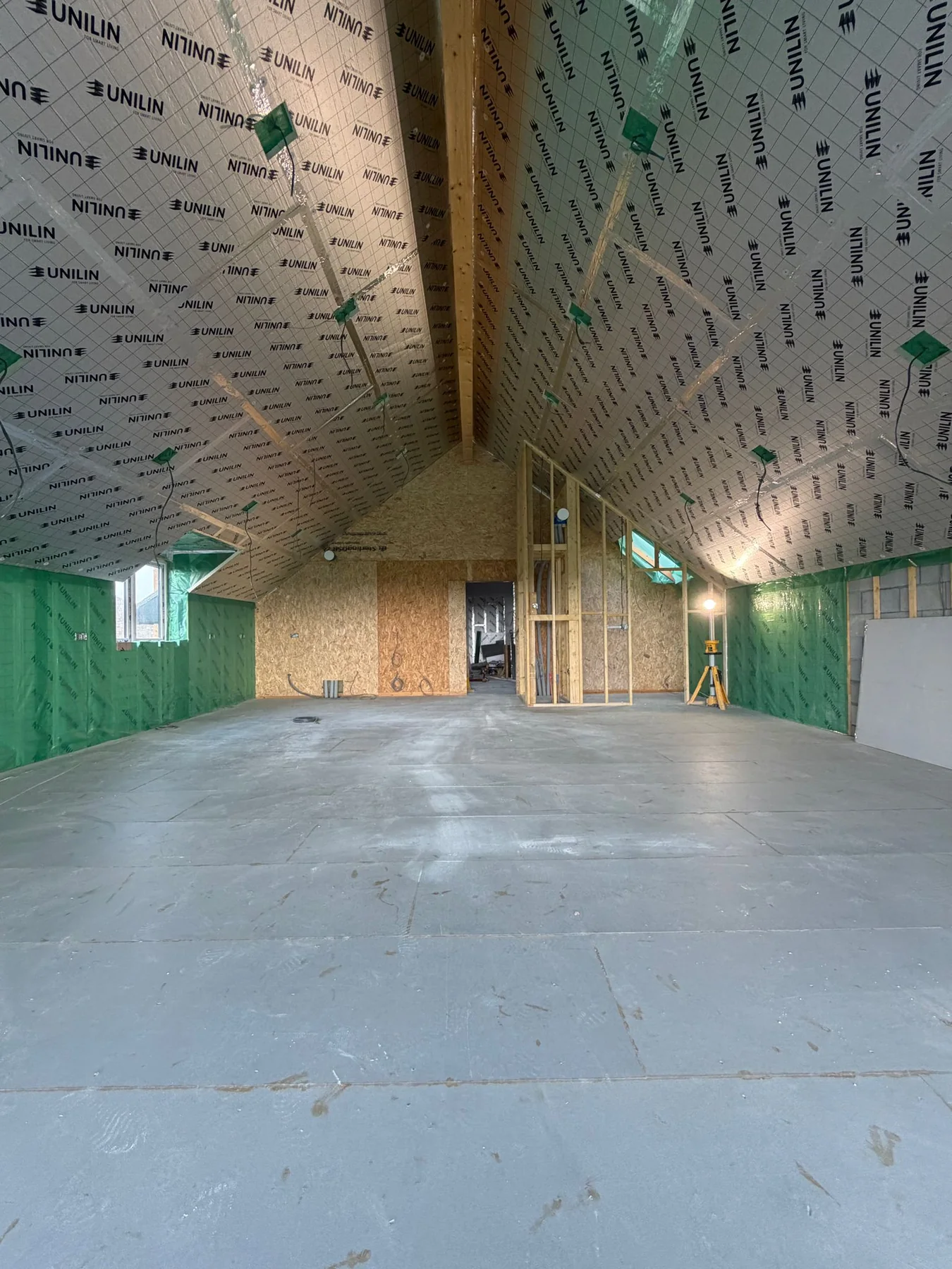 Cornwall new build by L W Construction — insulated open-plan shell after roof on, weather-tight stage