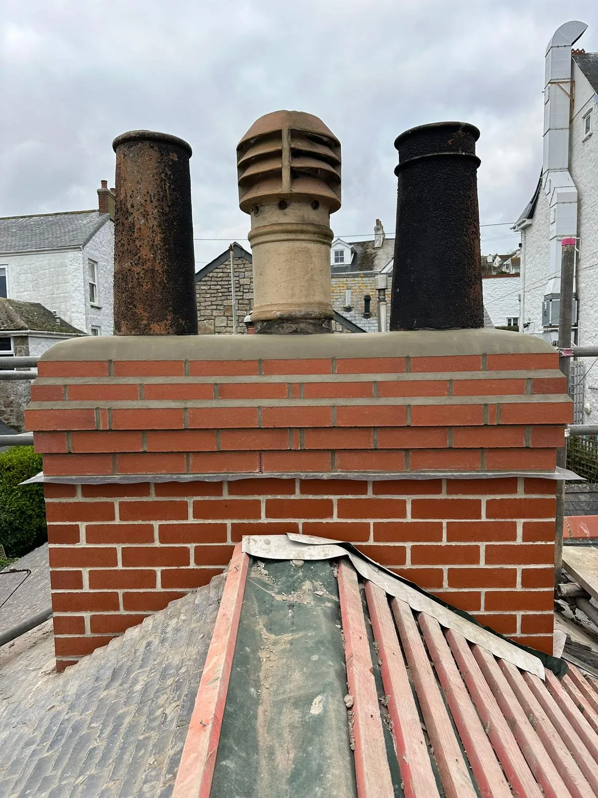 Three-flue ridge chimney rebuild by L W Construction — Cornwall — finished