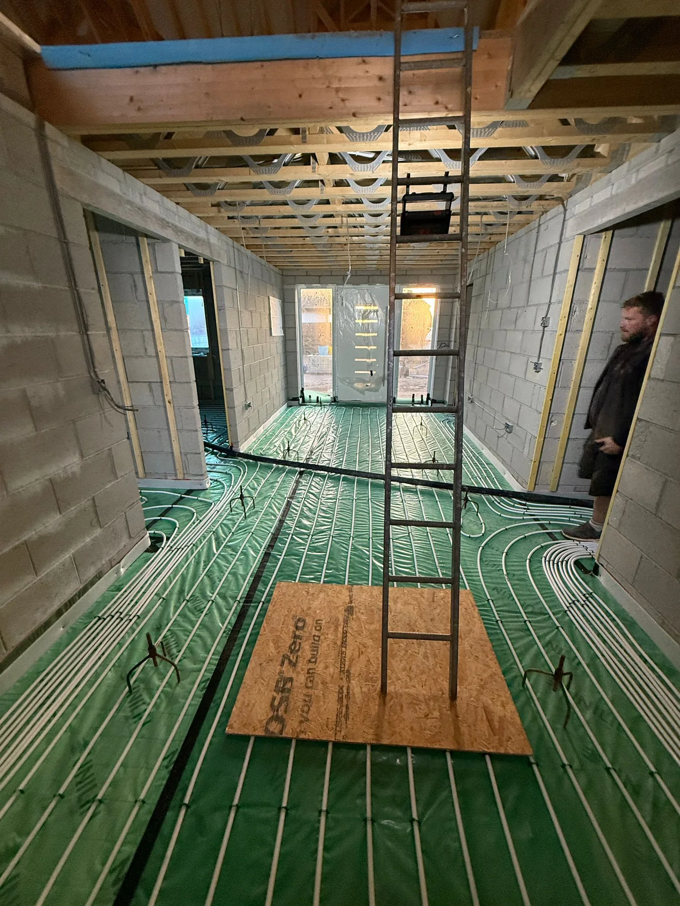 Cornwall new build by L W Construction — first-fix open-plan interior during build, services going in