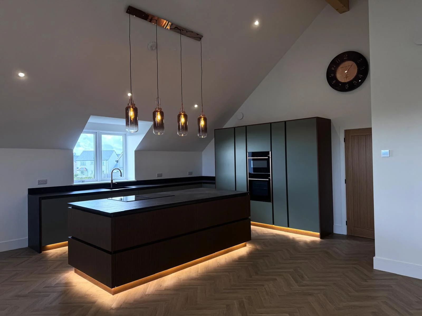 Recent Cornwall work by L W Construction — finished open-plan kitchen with island, premium new build