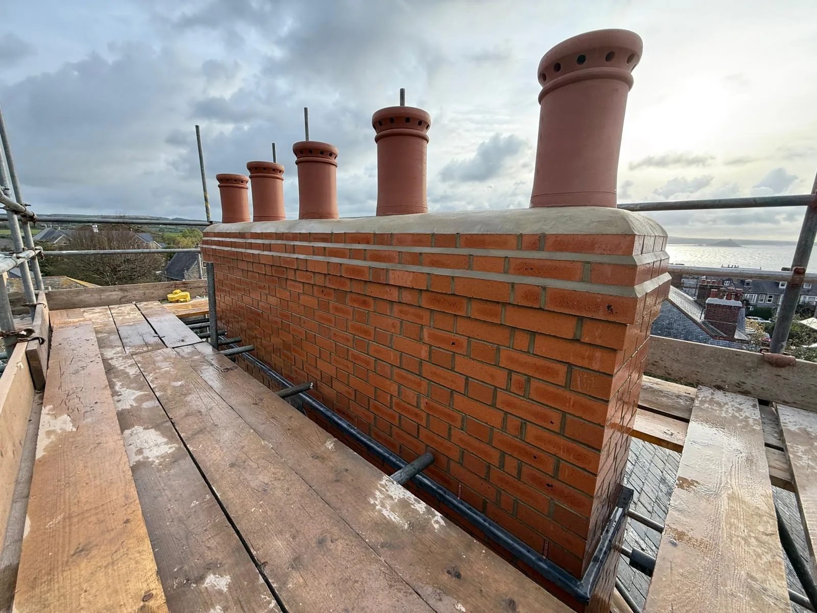 Multi-pot party-wall chimney rebuild by L W Construction — Cornwall