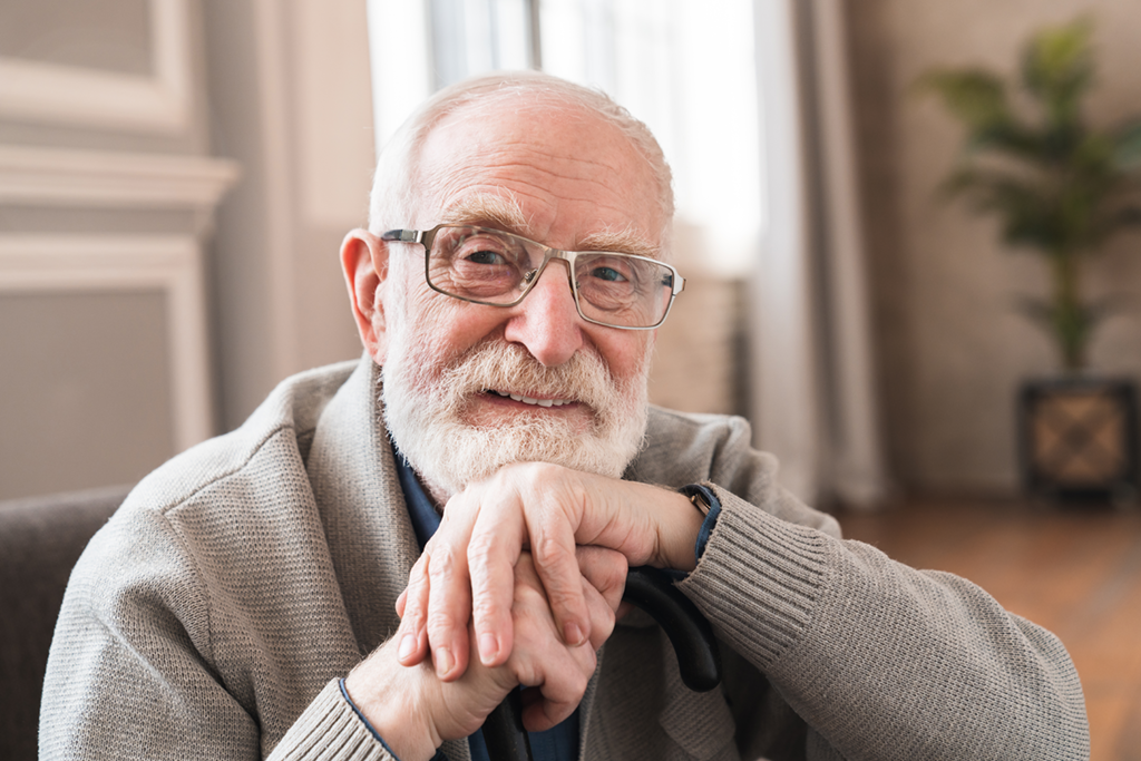 older man sitting in a room