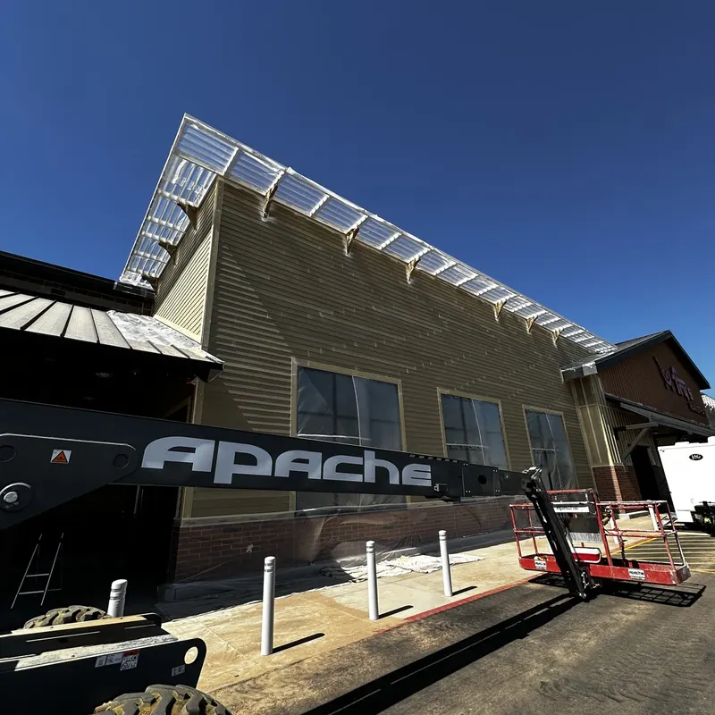 Retail exterior in progress with lift equipment on site