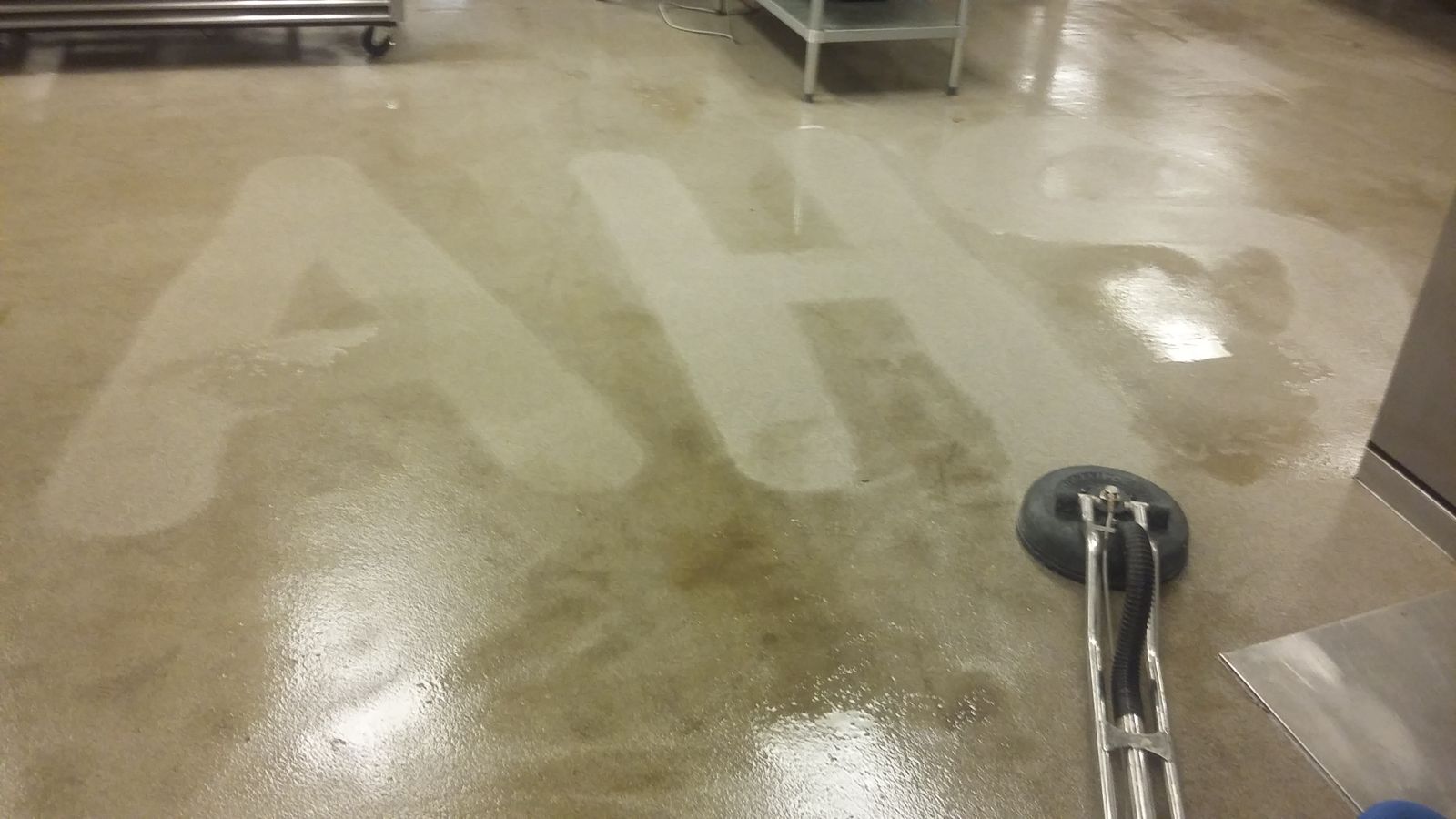 Commercial concrete floor with a logo cleaned into it