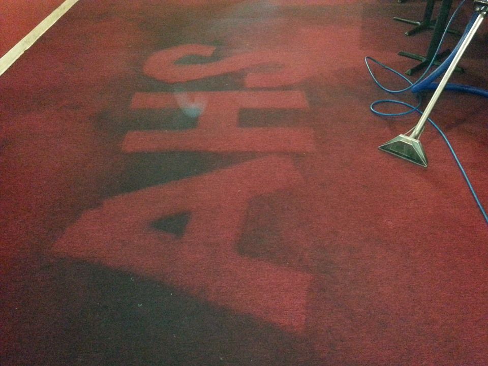 Commercial carpet with a logo cleaned into it