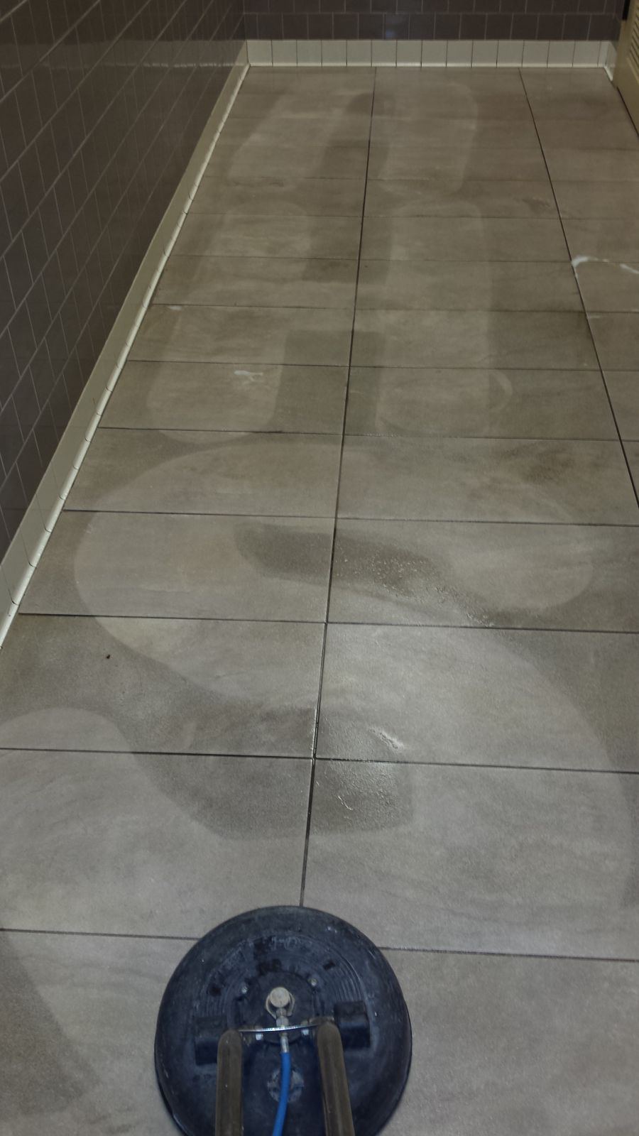 Hallway grout with cleaned section
