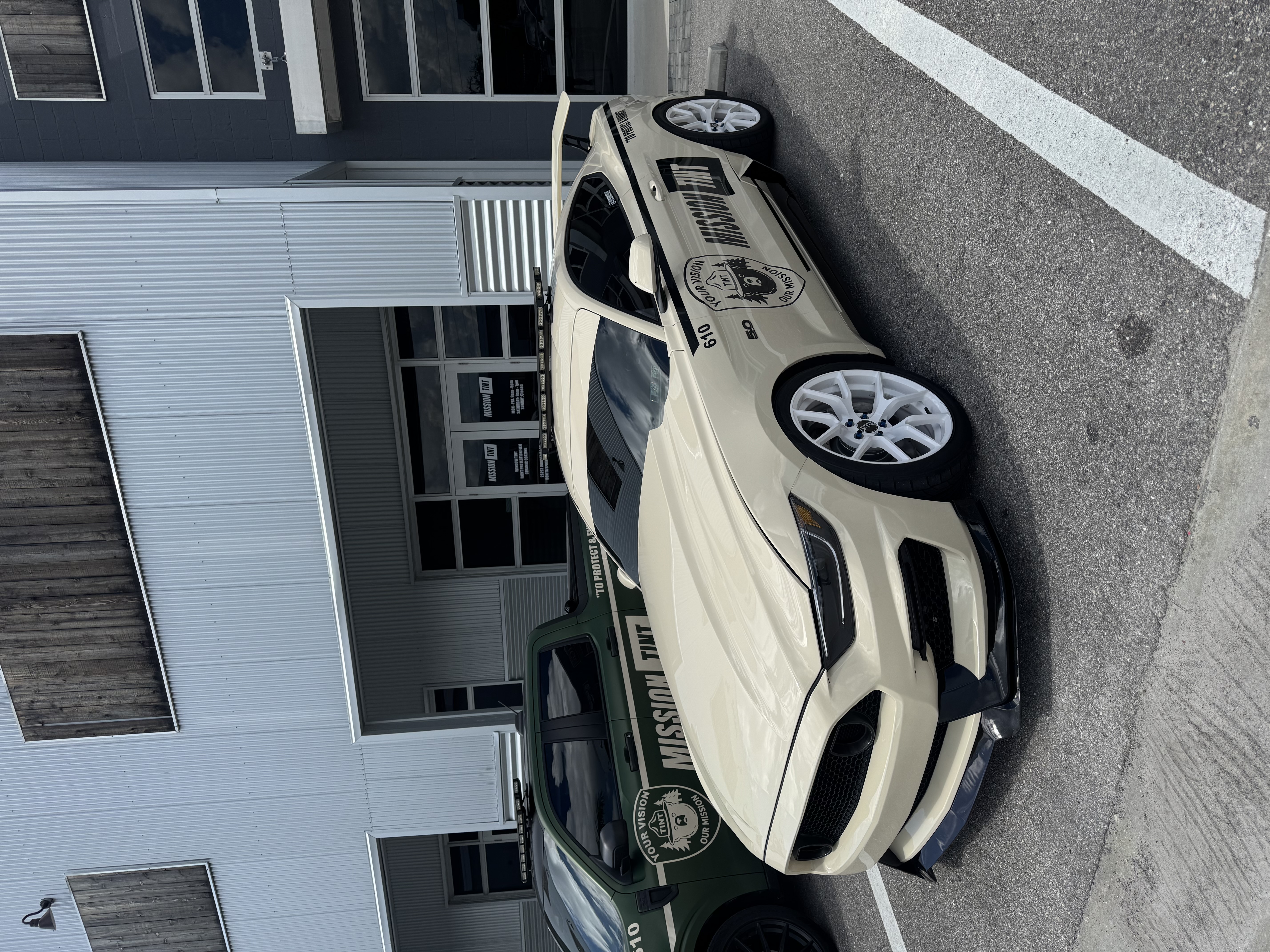 Mitchell Clary's white Ford Mustang outside the Mission Tint shop