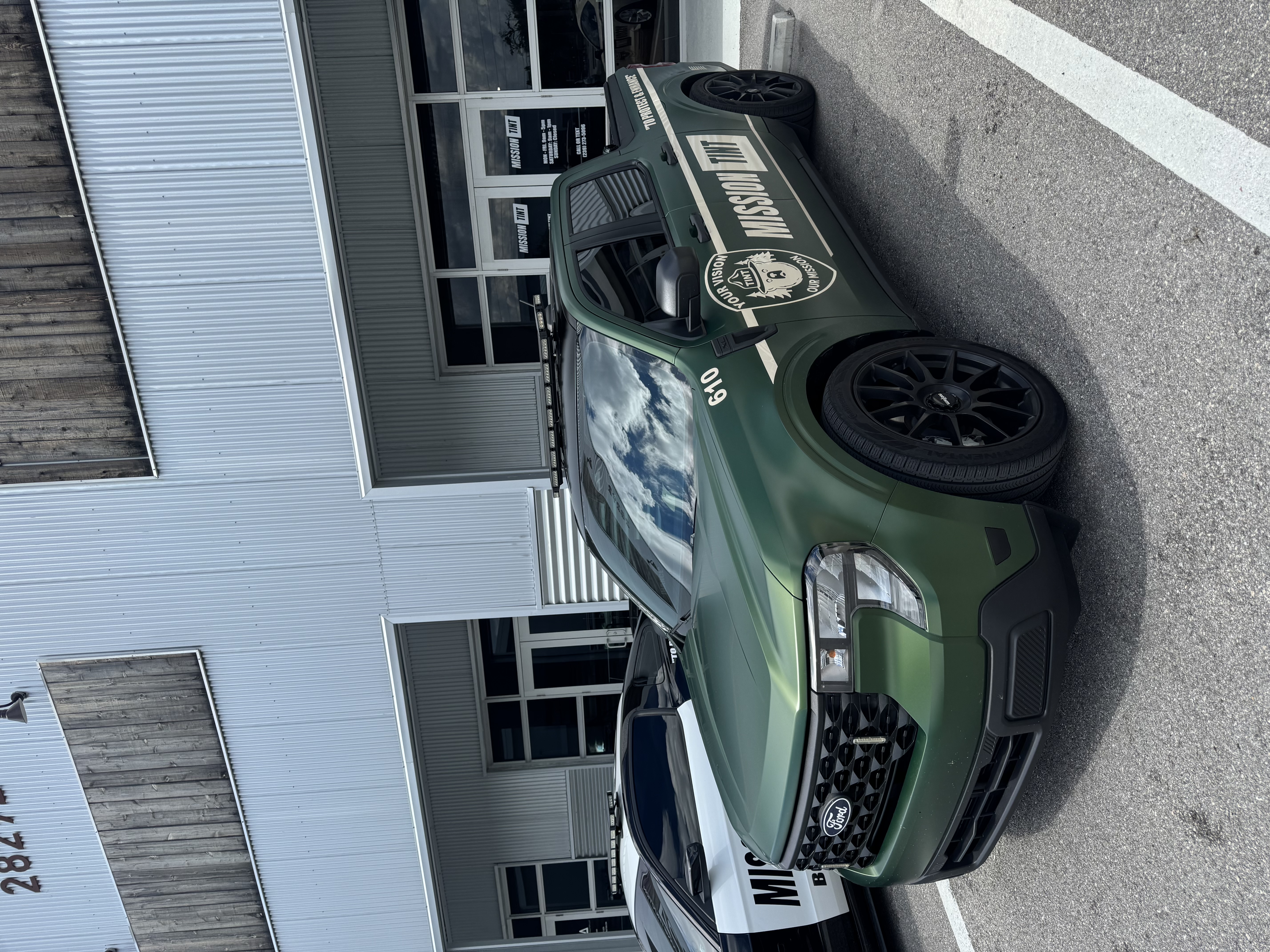 Colin Smith's green Ford Maverick outside the Mission Tint shop