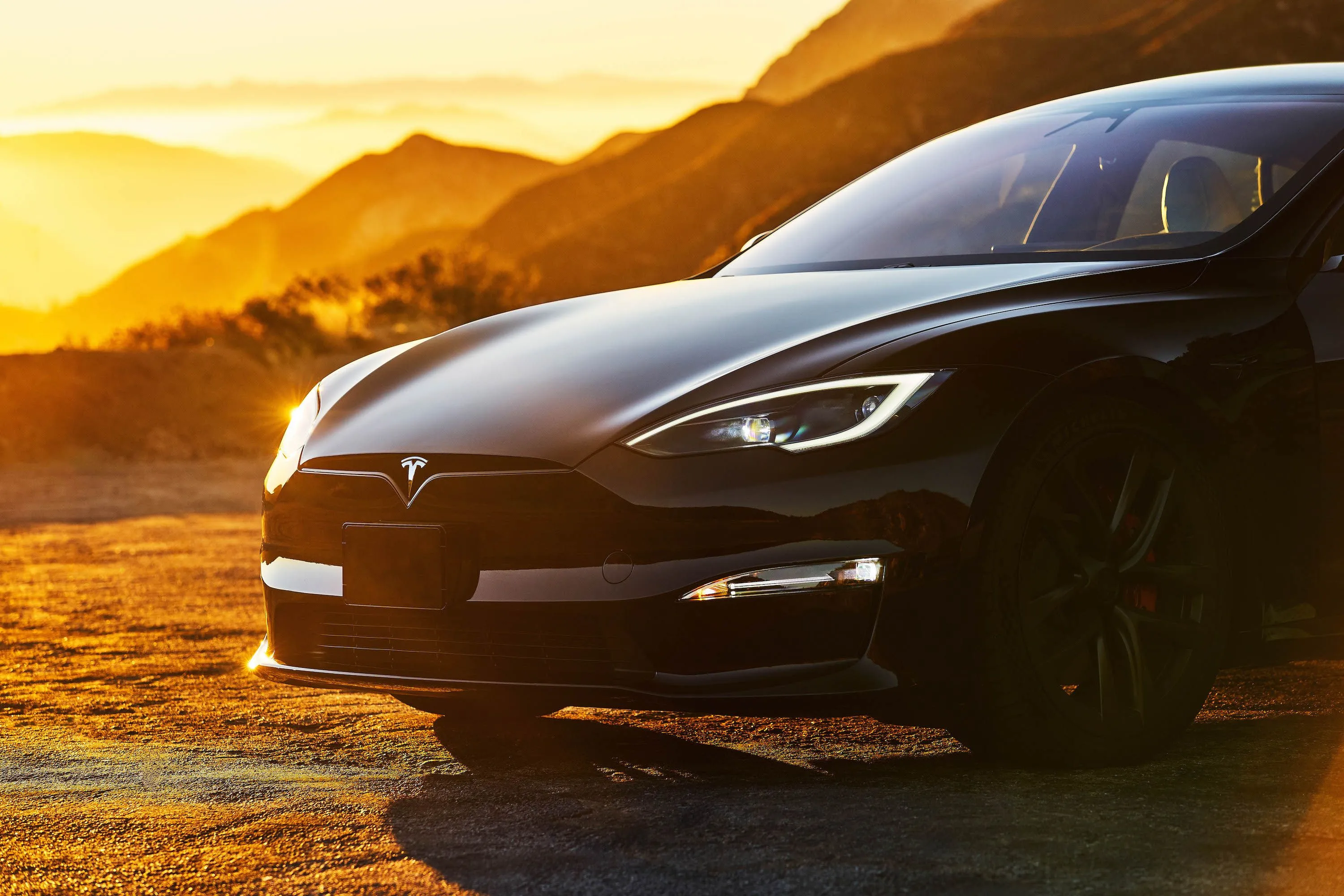 Black Tesla Model S at sunset after window tint by Mission Tint