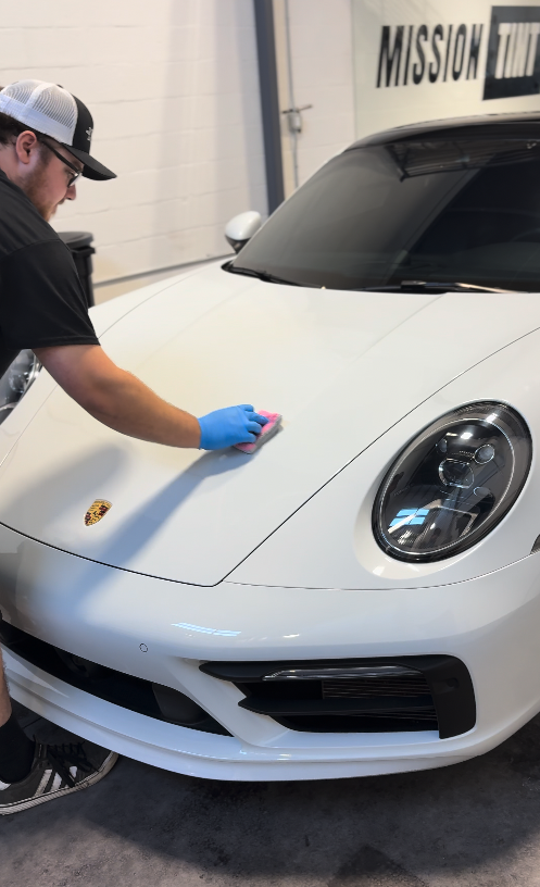 Ceramic coating being applied to paint
