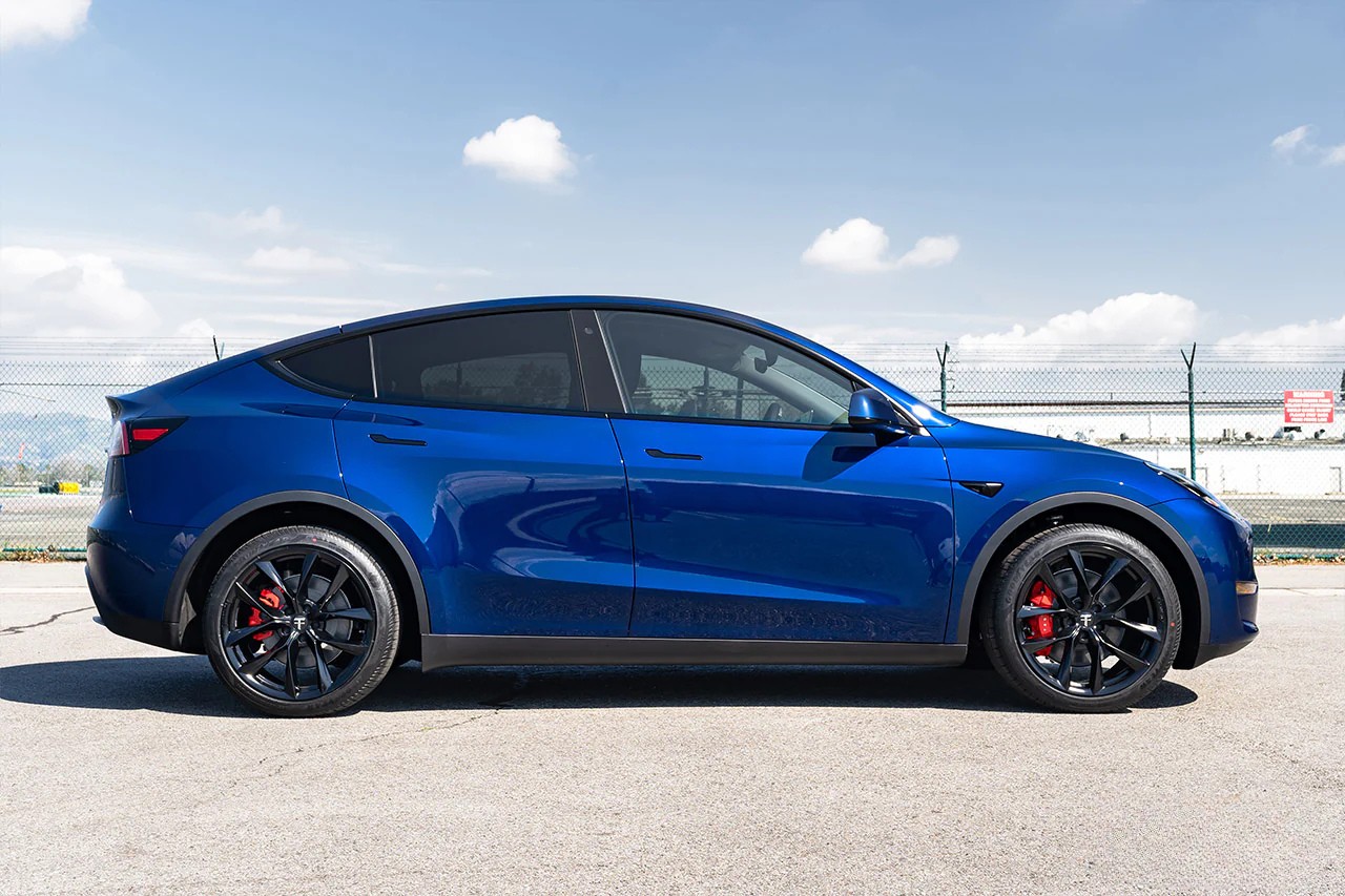 Blue Tesla Model Y after window tint by Mission Tint