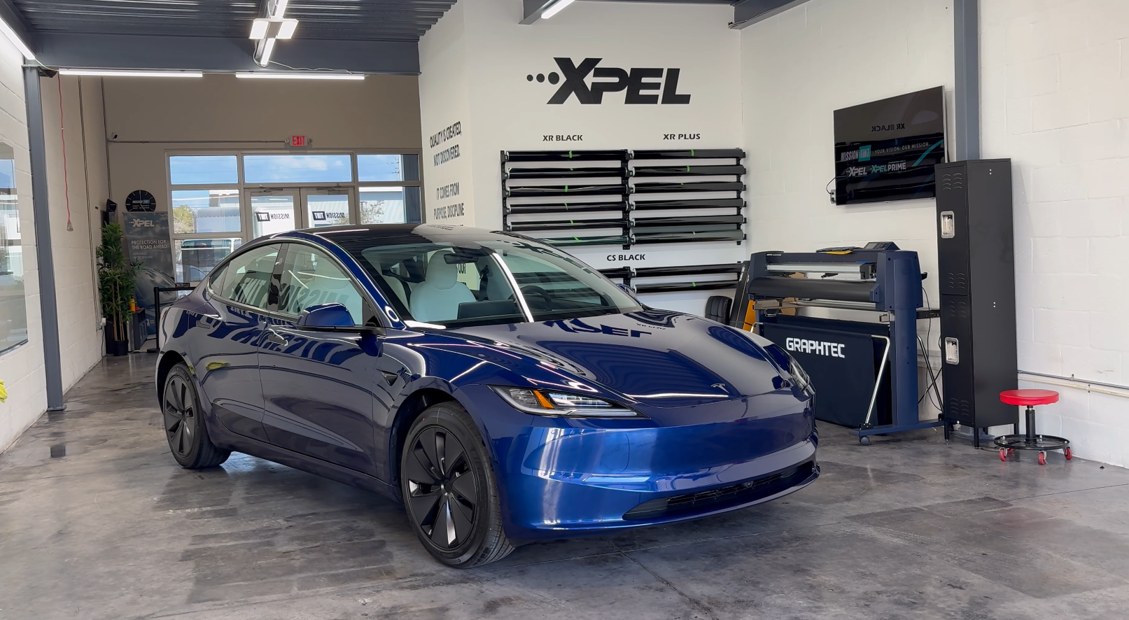 2026 Tesla Model 3 in the Mission Tint shop, second view