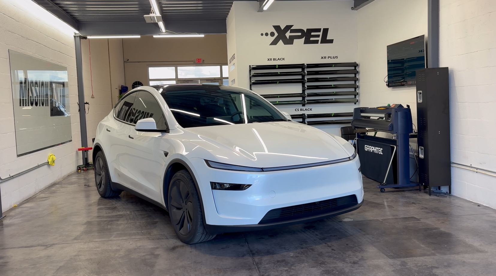 2026 Tesla Model Y Long Range in the Mission Tint shop, second view