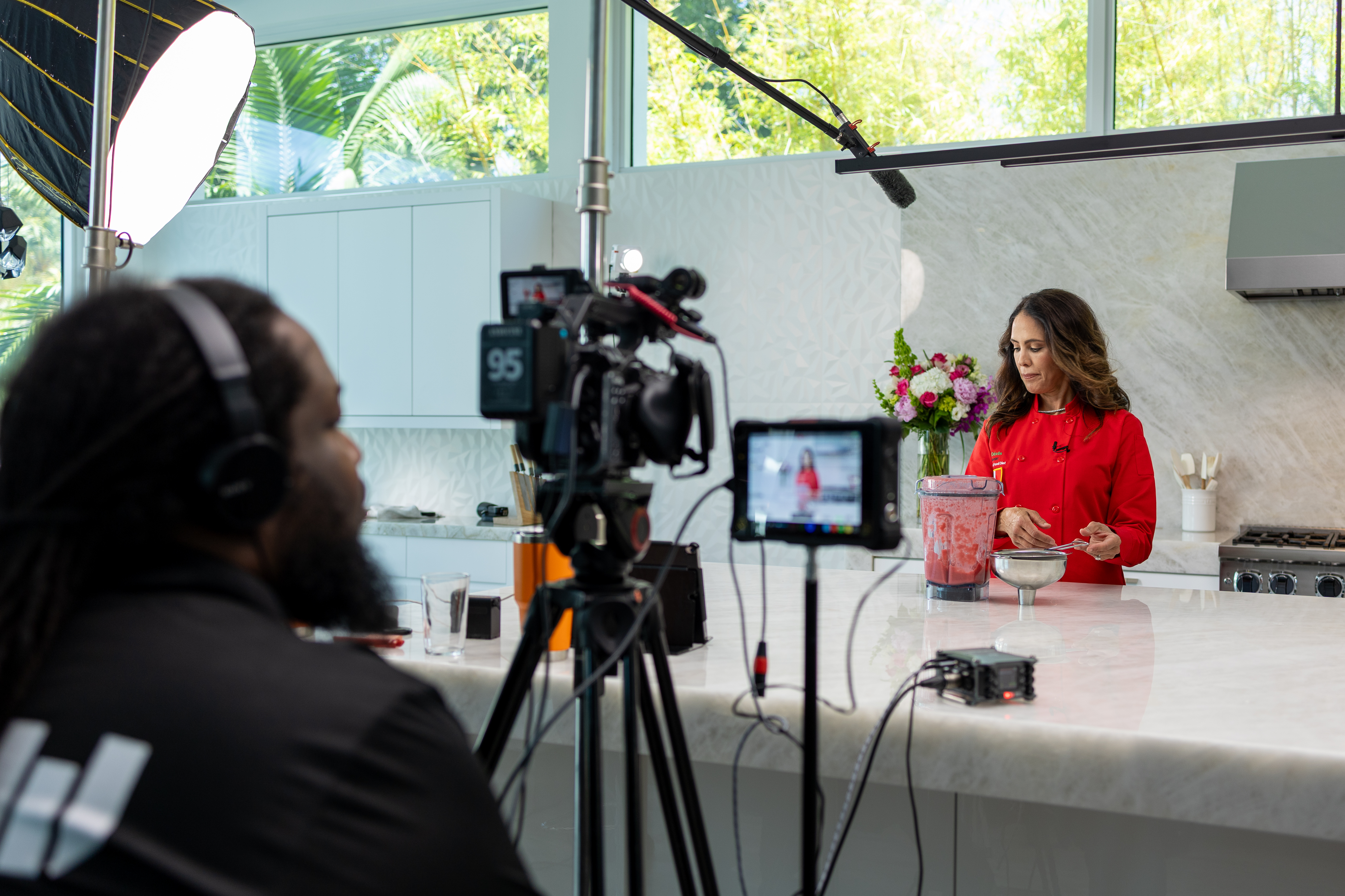 KMG production team filming an interview on location