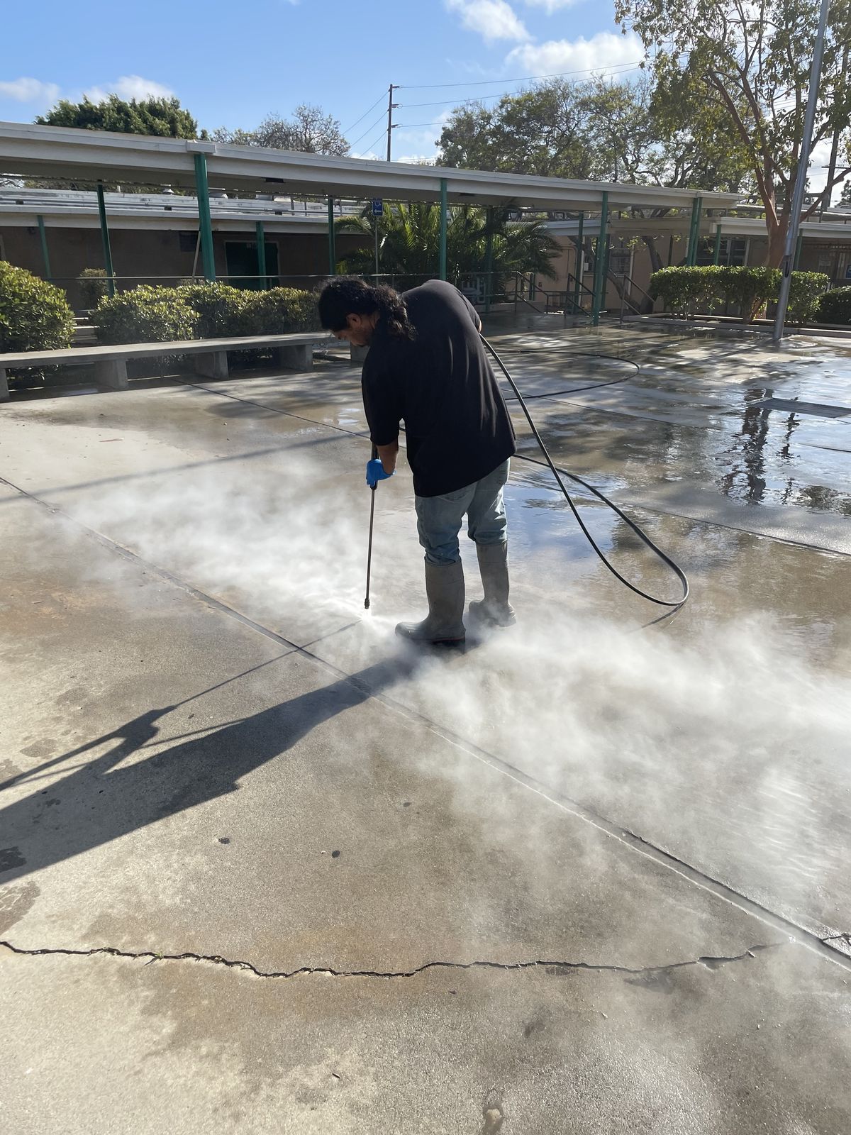 Pressure washing a driveway