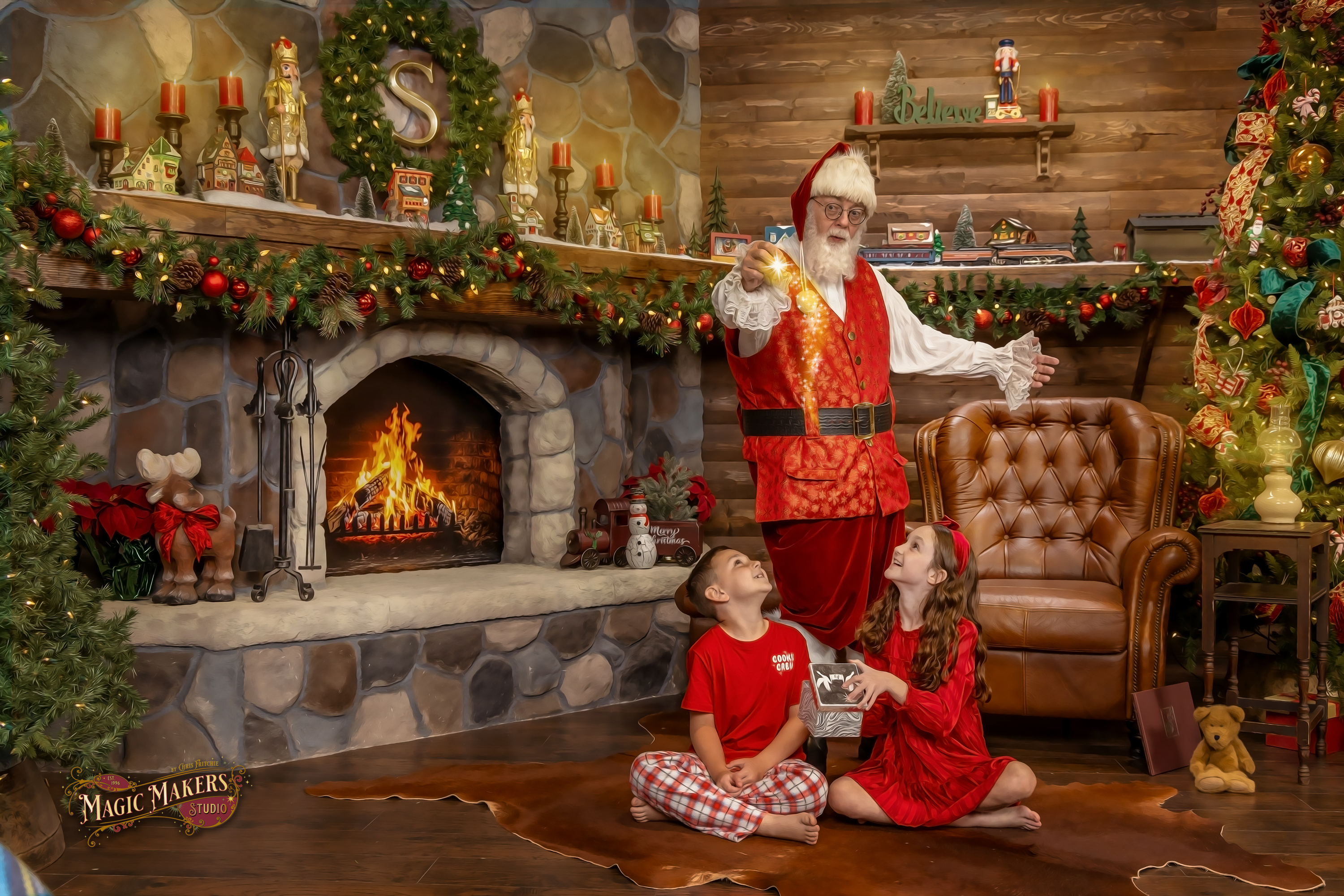 Santa Mike making Christmas magic from the Magic Box as children look up in wonder during The Magic of Santa experience