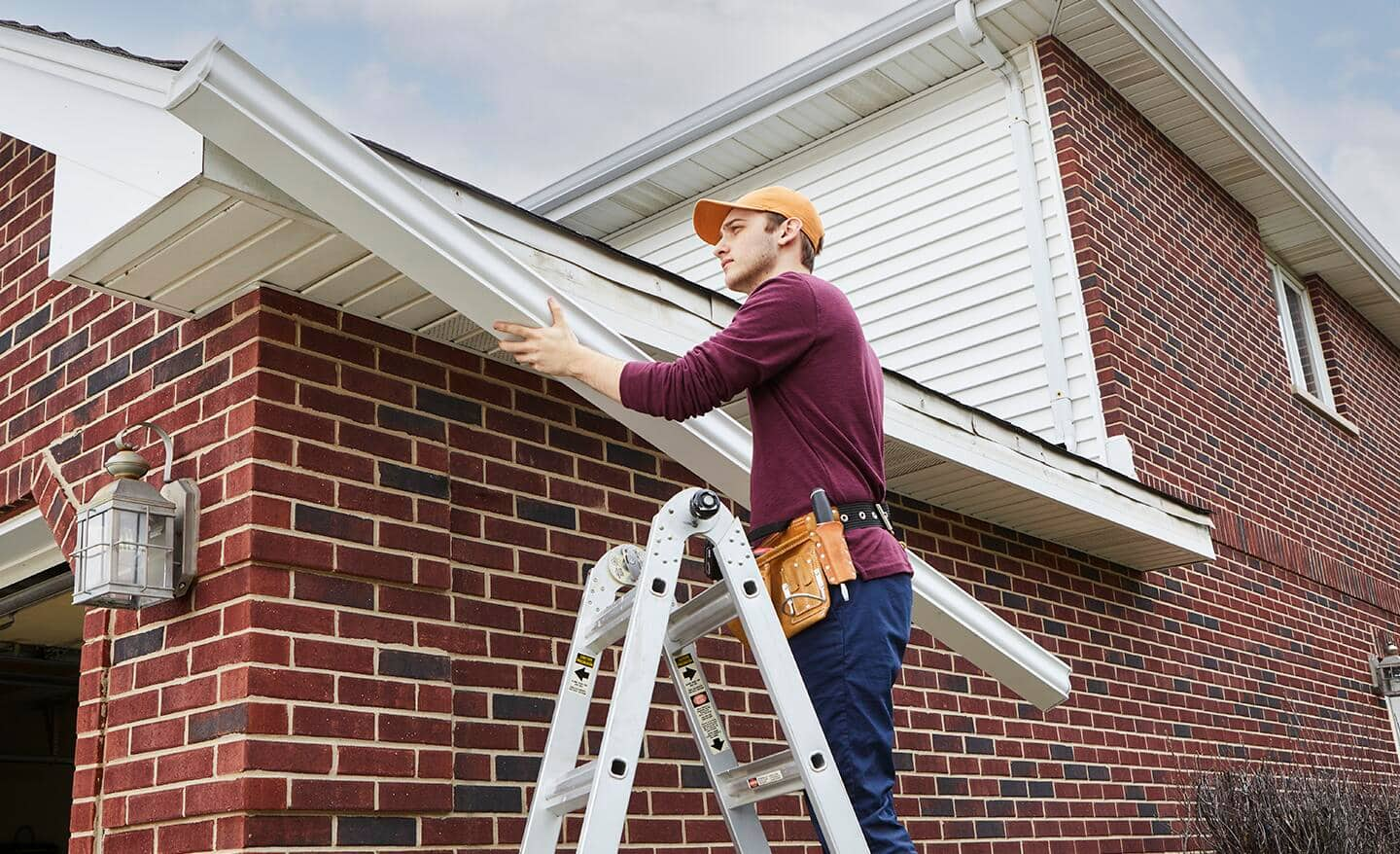 Roof inspection and repair concept illustration featuring roofing tools, safety equipment, and a residential property.