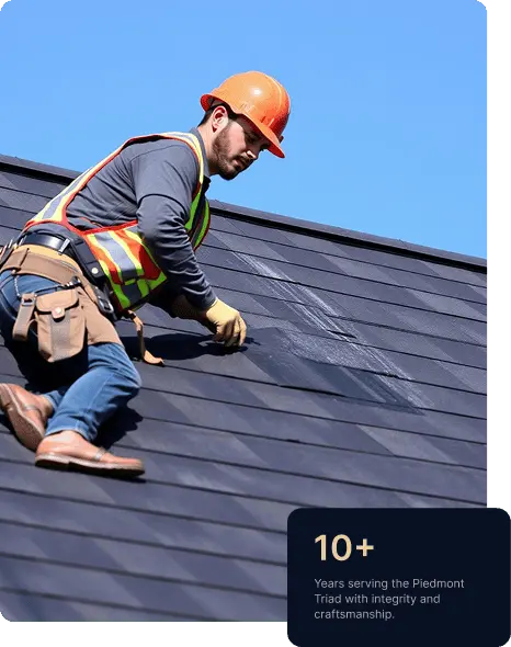 Professional roofing contractor installing dark roof shingles on a residential roof, wearing safety gear and tool belt, with 10+ years of roofing experience highlighted.