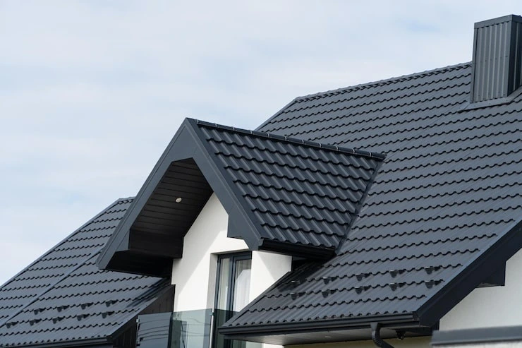 Completed residential roofing system featuring professionally installed asphalt shingles