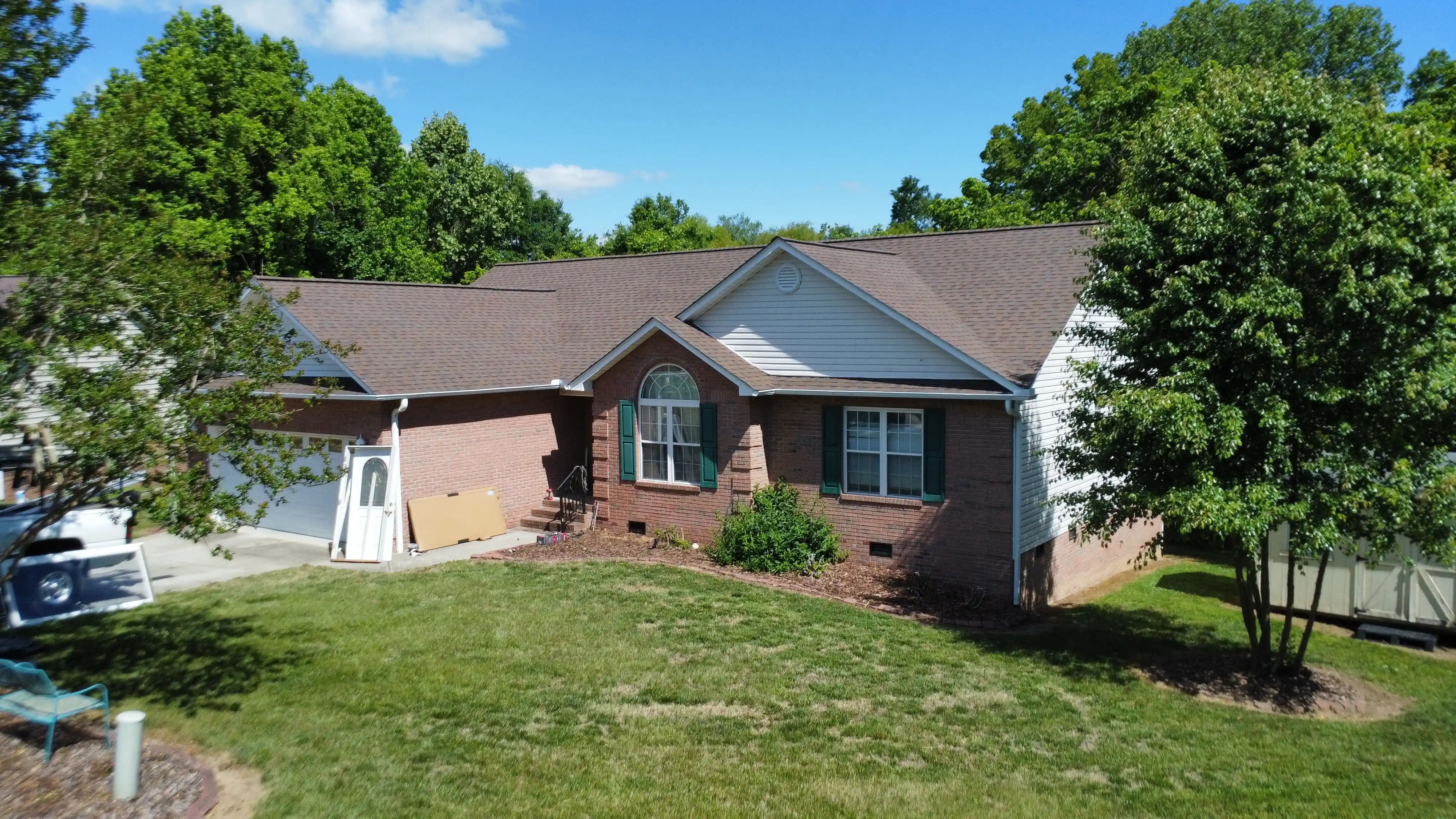 Completed roof installation featuring durable asphalt shingles and quality workmanship.