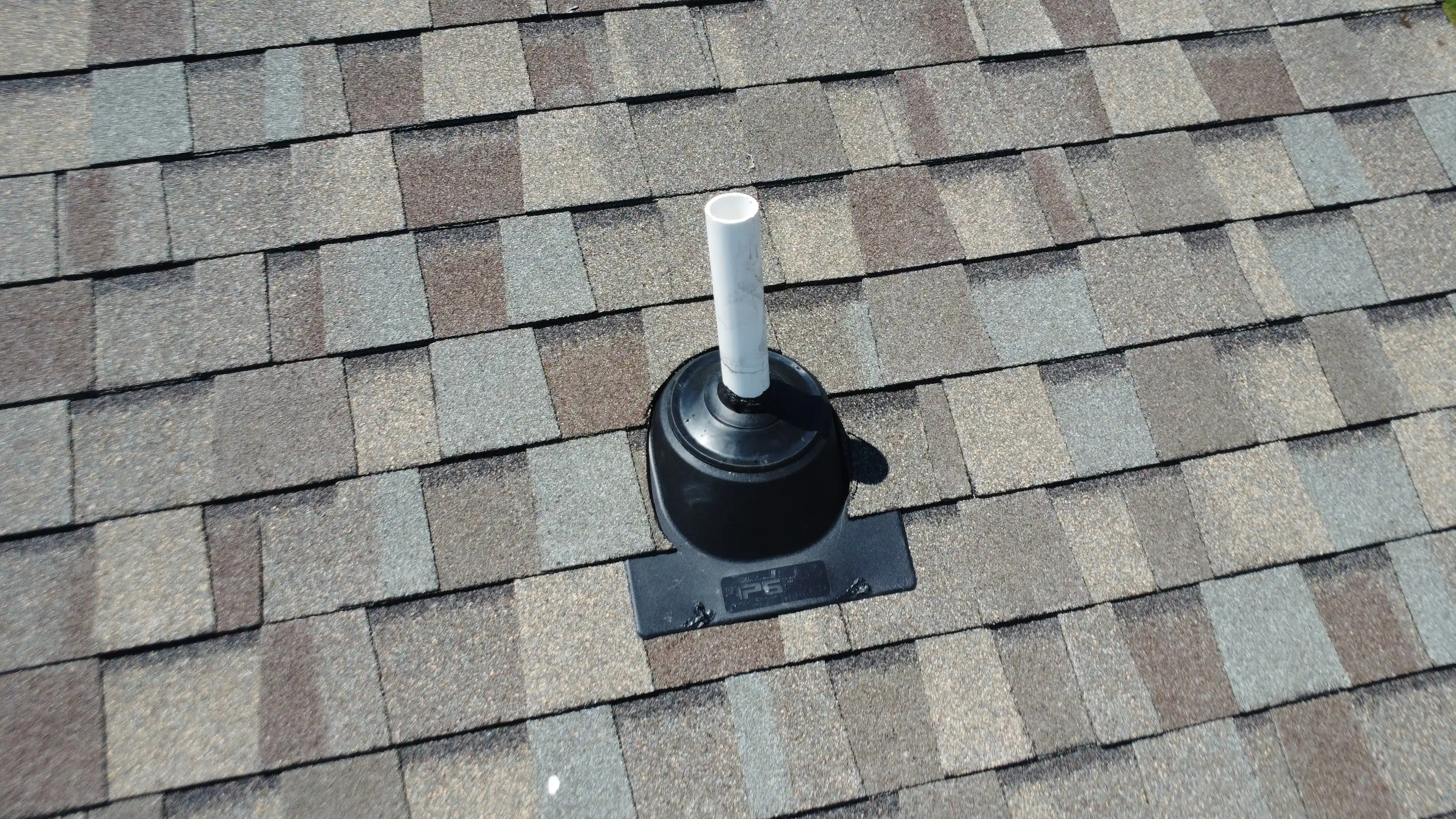 Close-up view of a completed roofing system with professionally installed shingles