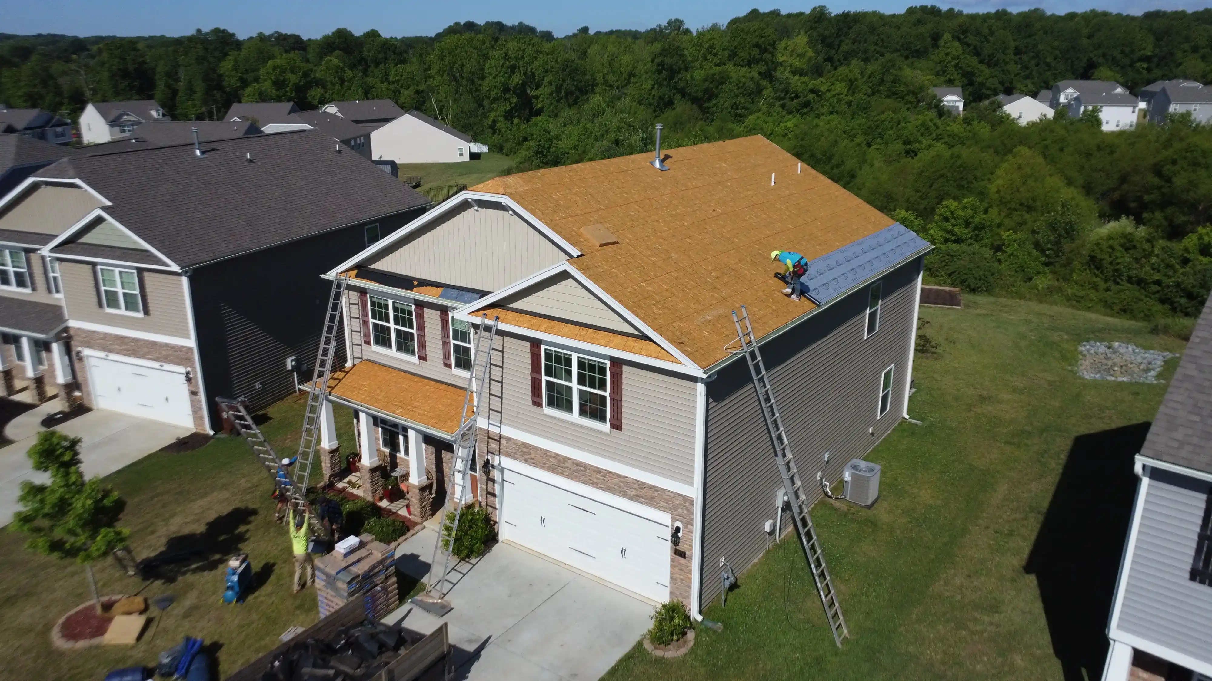 esidential home with a newly installed asphalt shingle roof.