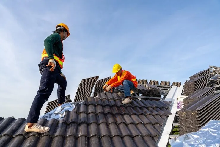 Happy homeowner after roof replacement
