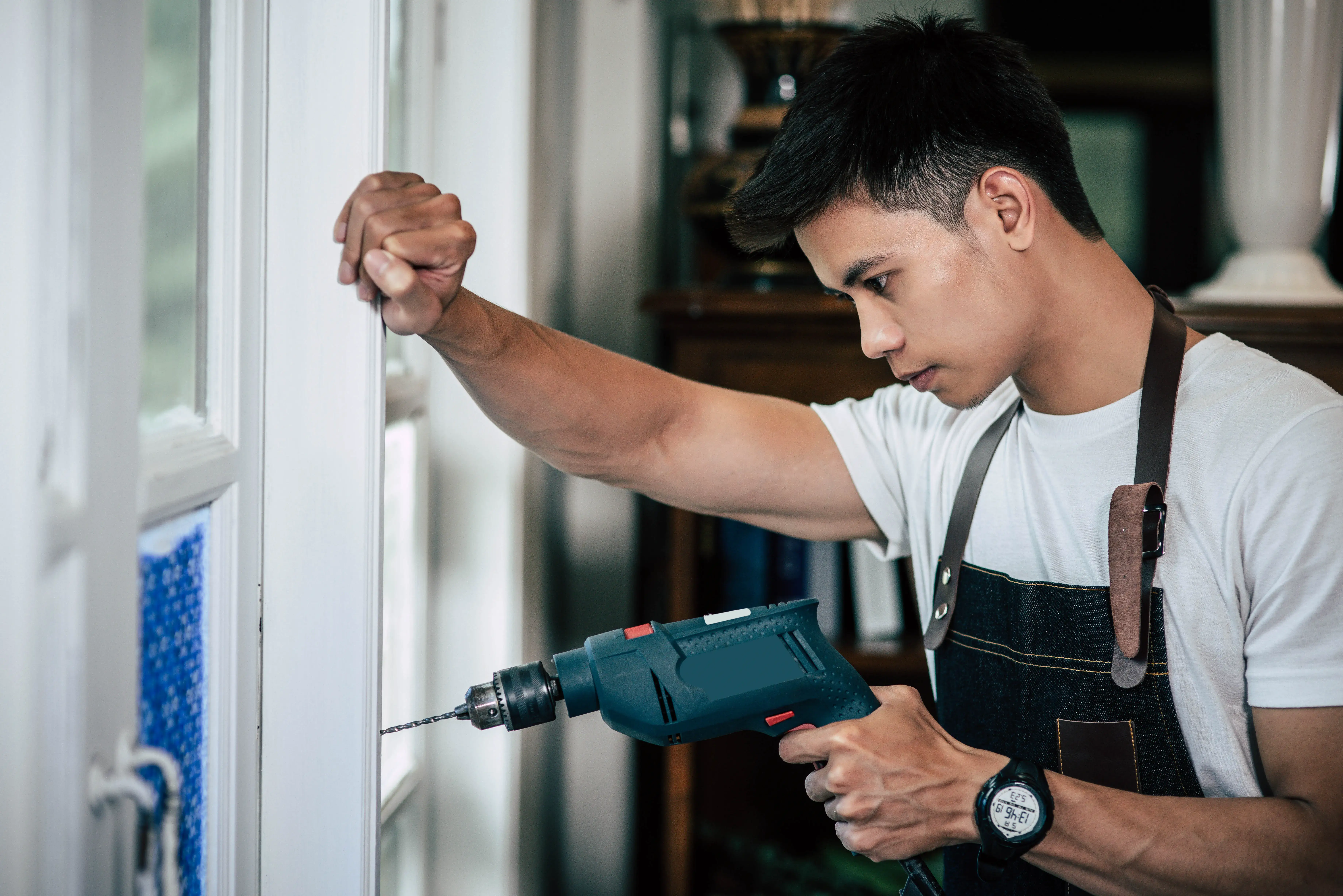 Professional cabinet refinishing service in modern white kitchen