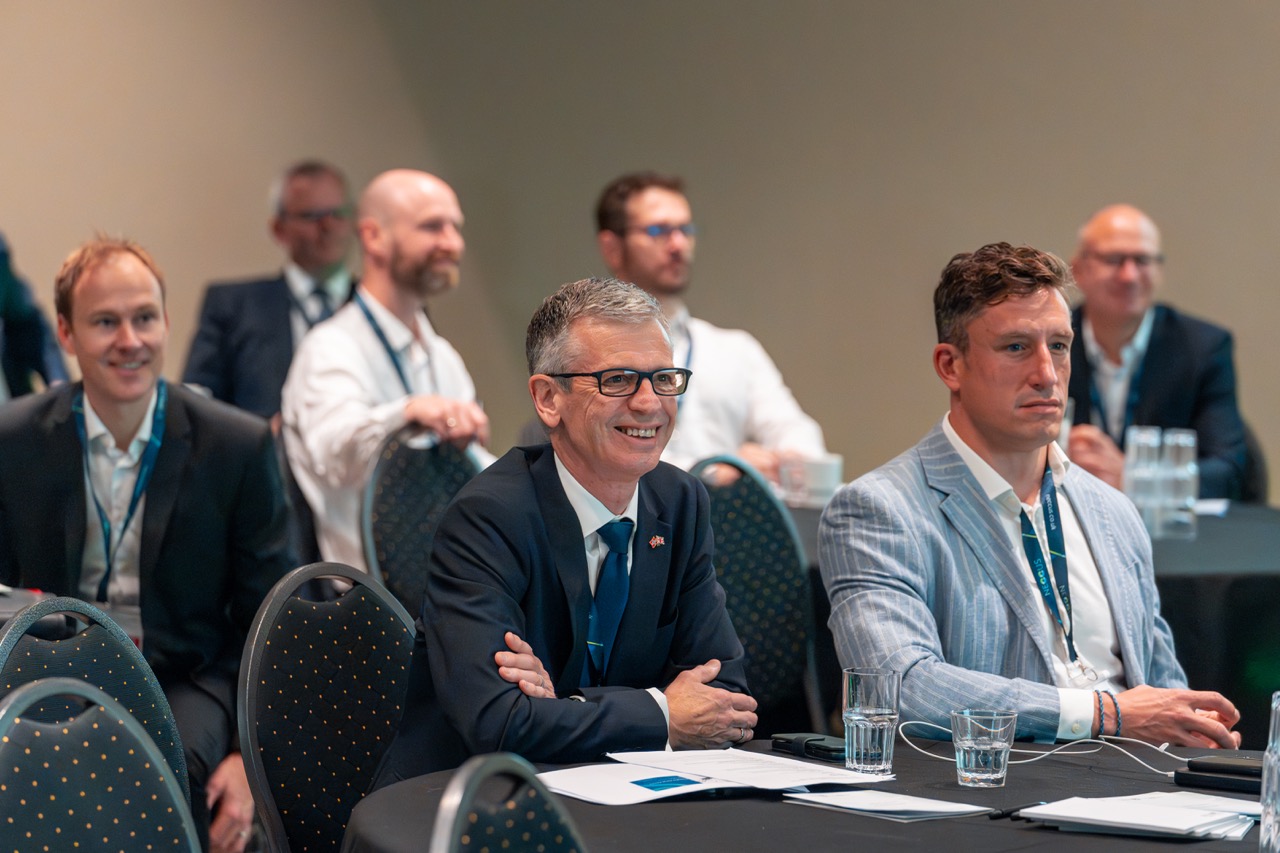 Conference delegates engaged in a session at a corporate event in Oslo