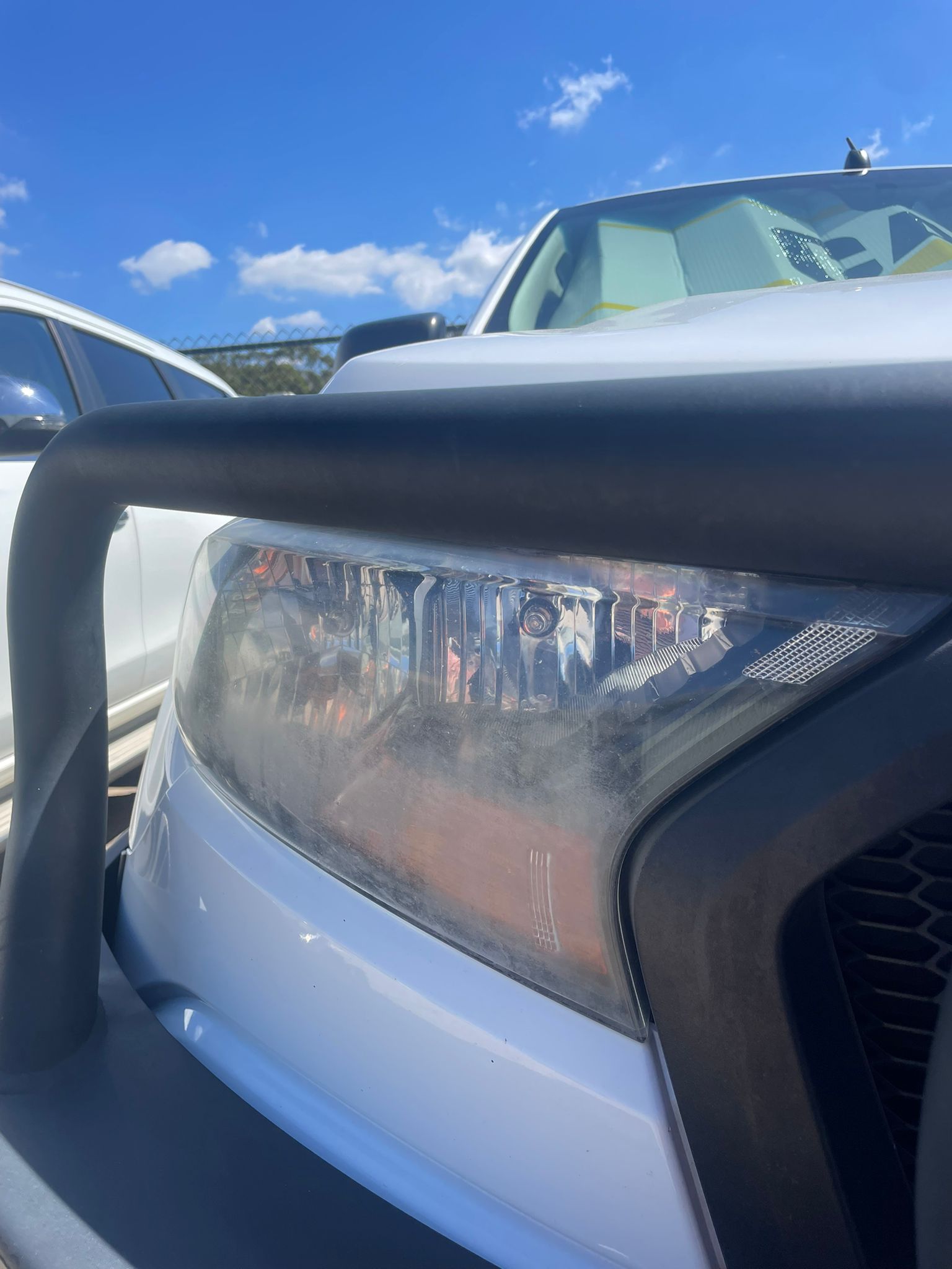 Foggy oxidised headlight before restoration — High Shine Club Brisbane