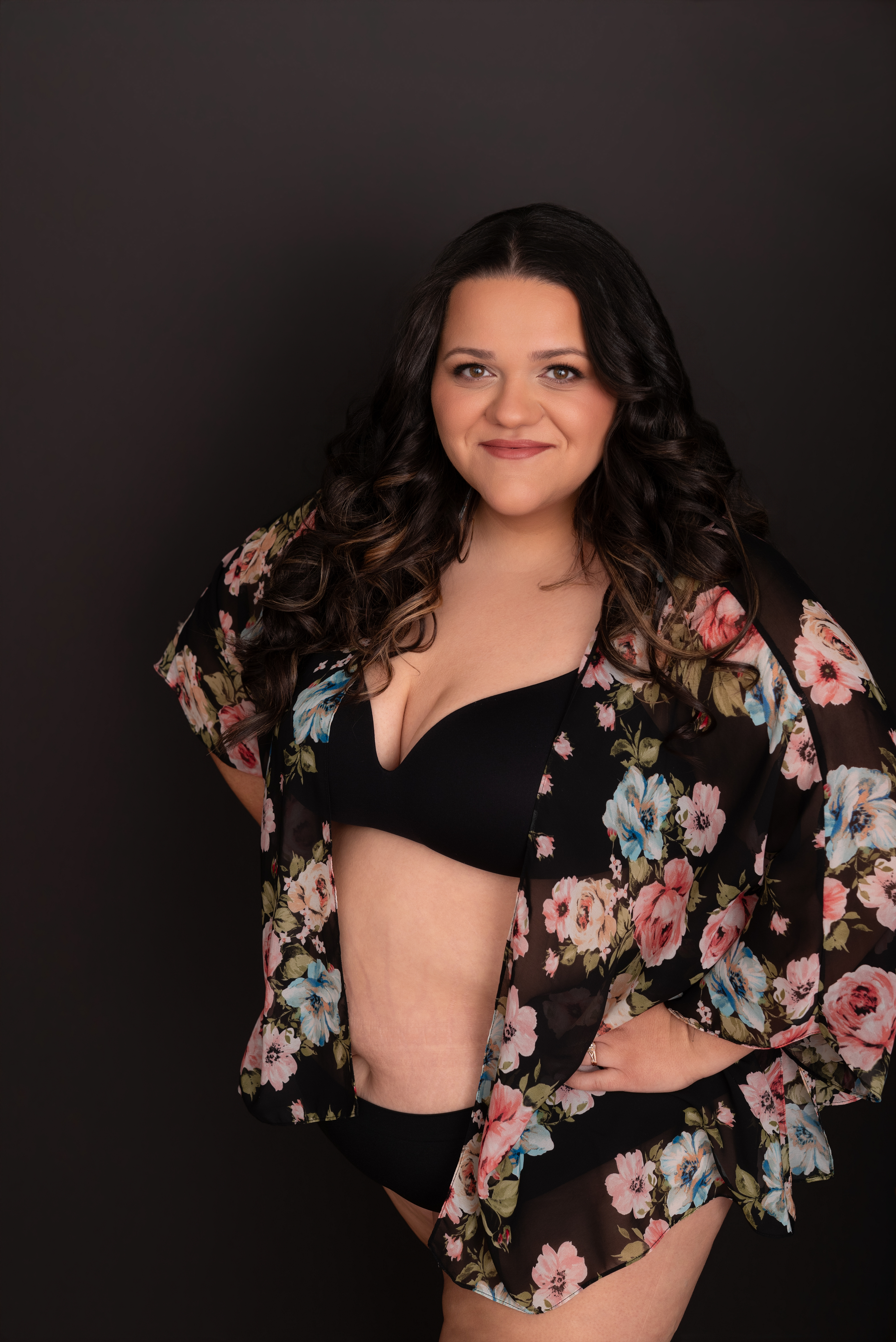 Portrait of Nicole looking confident in her floral shawl and underwear