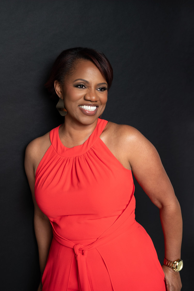 Personal branding portrait of counselor Davina wearing a pink jumpsuit during a Kansas City branding photography session.