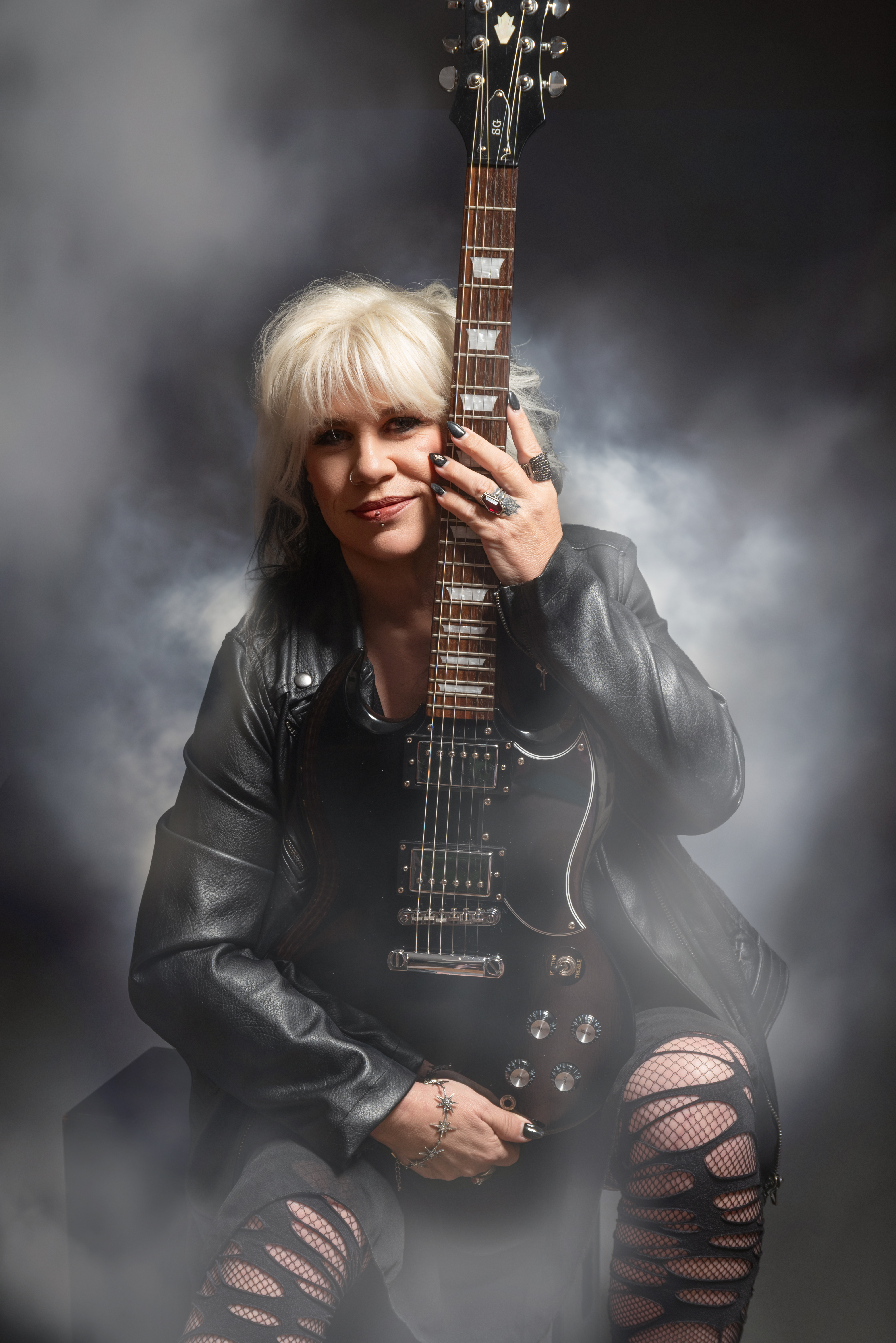 80s rocker chick client vibe with electric guitar and studio smoke effects at Springfield portrait studio