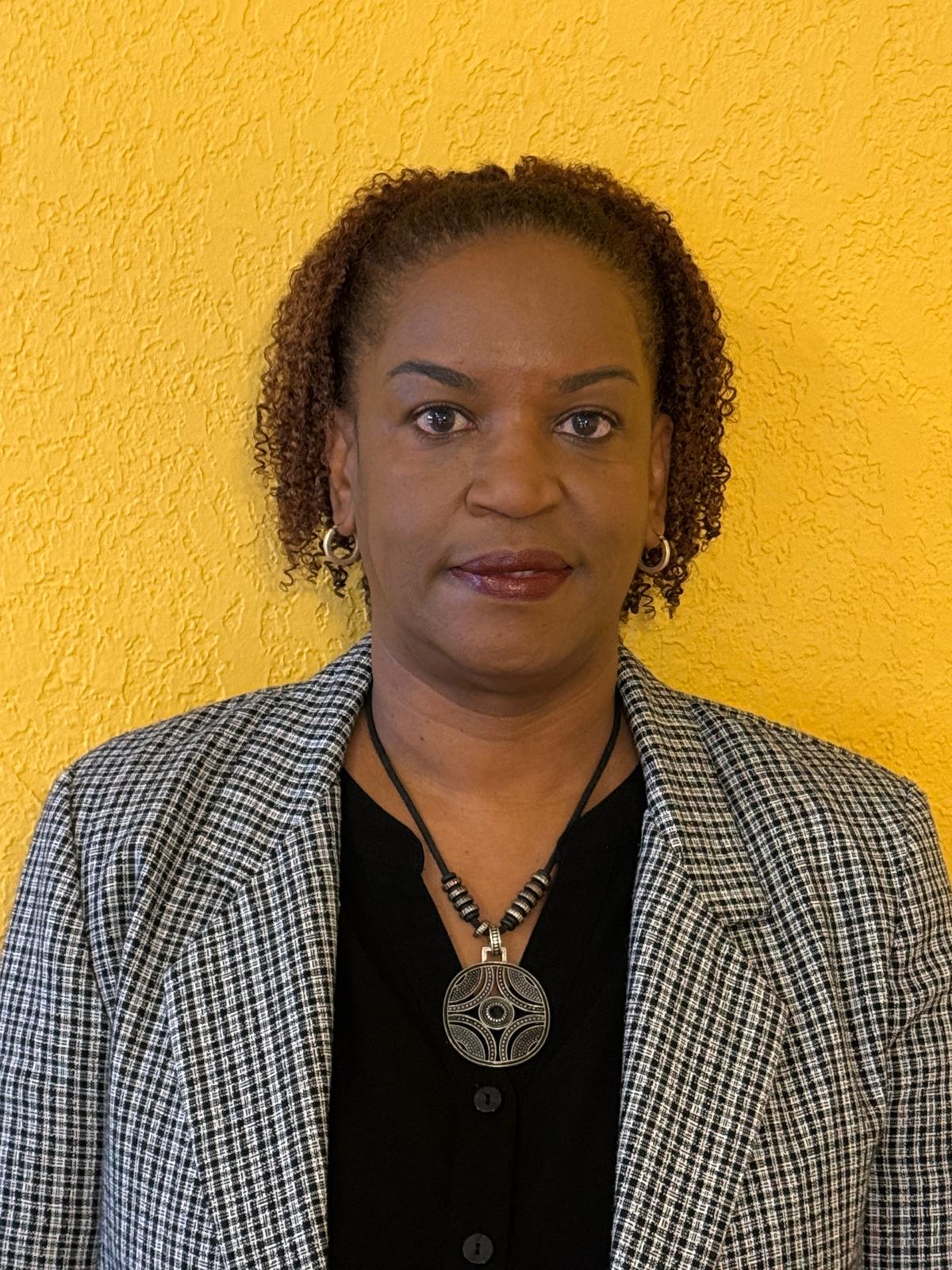 Portrait of Dr. Louise Aurélien-Buie, founder and CEO of Elite Mindful Health.