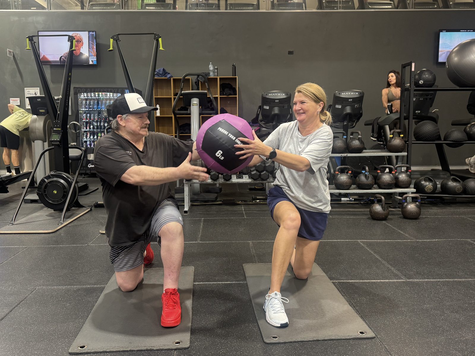 Strength Club members training with a medicine ball at Goodlife Burleigh