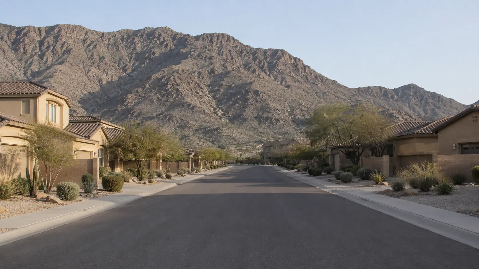 Residential street with mountain backdrop in Maricopa, Arizona 85139